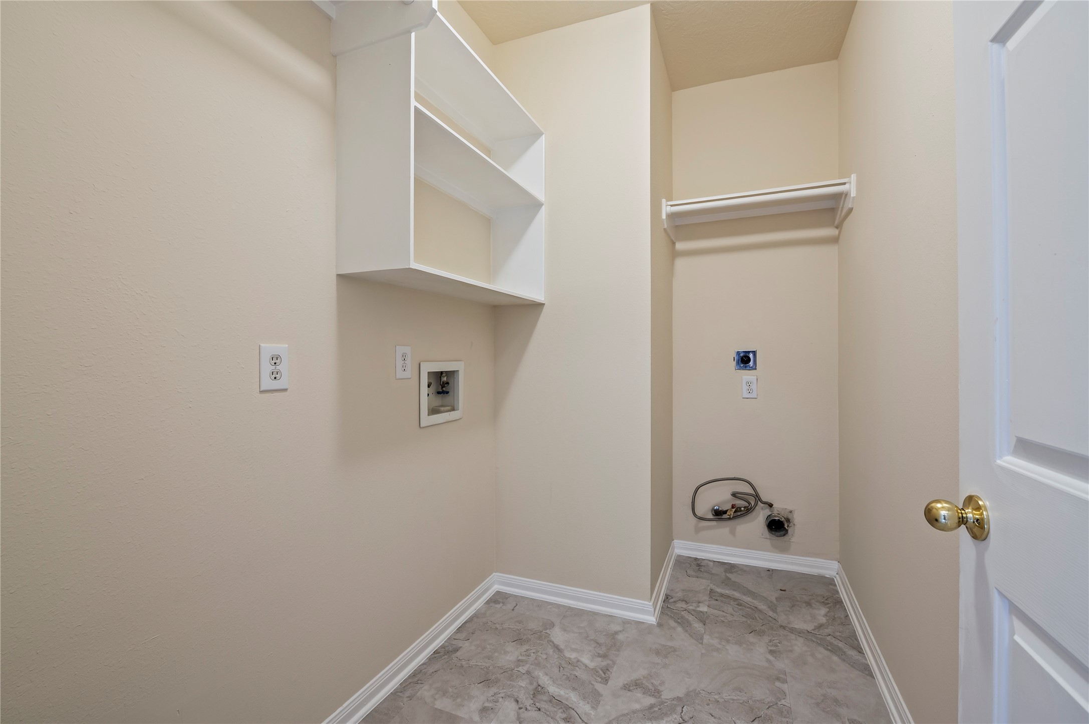 Laundry room downstairs. Gas and electric dryers connections