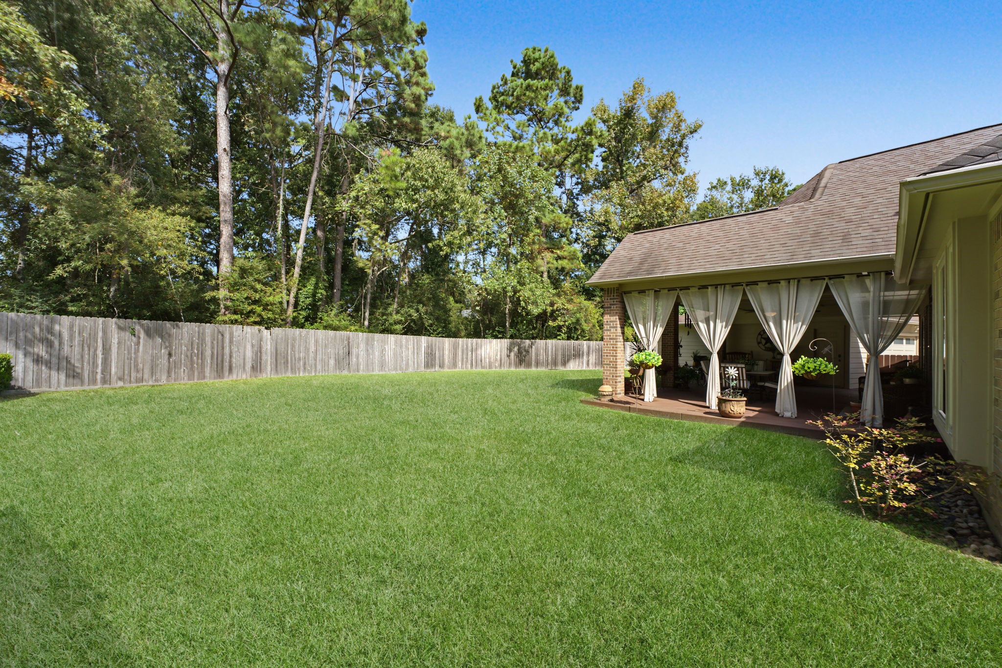 Full gutters all the way around the house. Nothing but towering trees behind your fence.