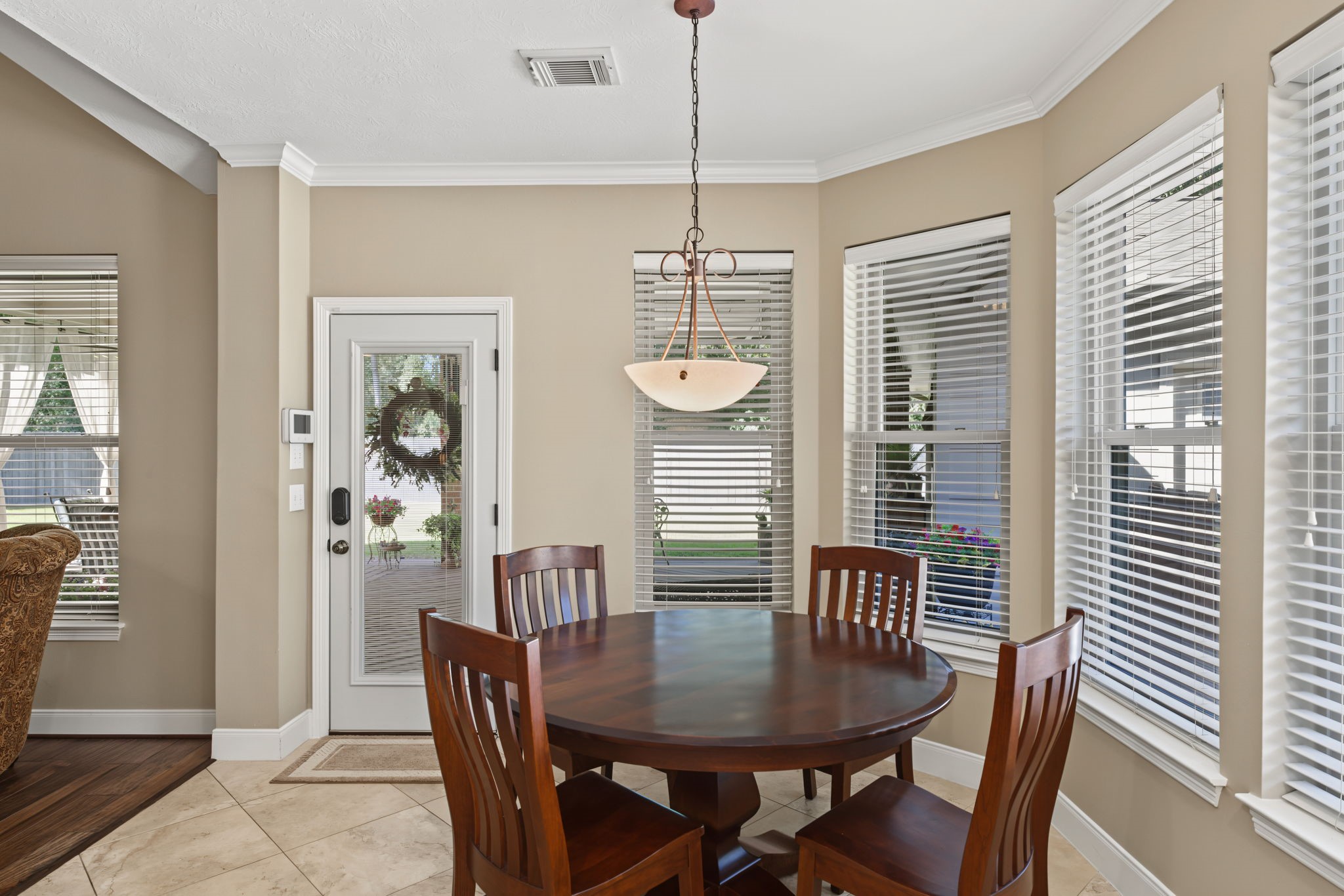 This breakfast area is approx 10' x 9'. The double-pane windows keep this area from getting hot or cold.