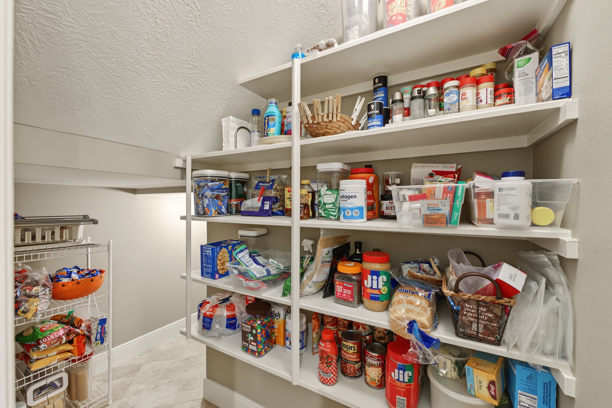 This Pantry goes around the corner and makes another turn behind that wall! Great storage