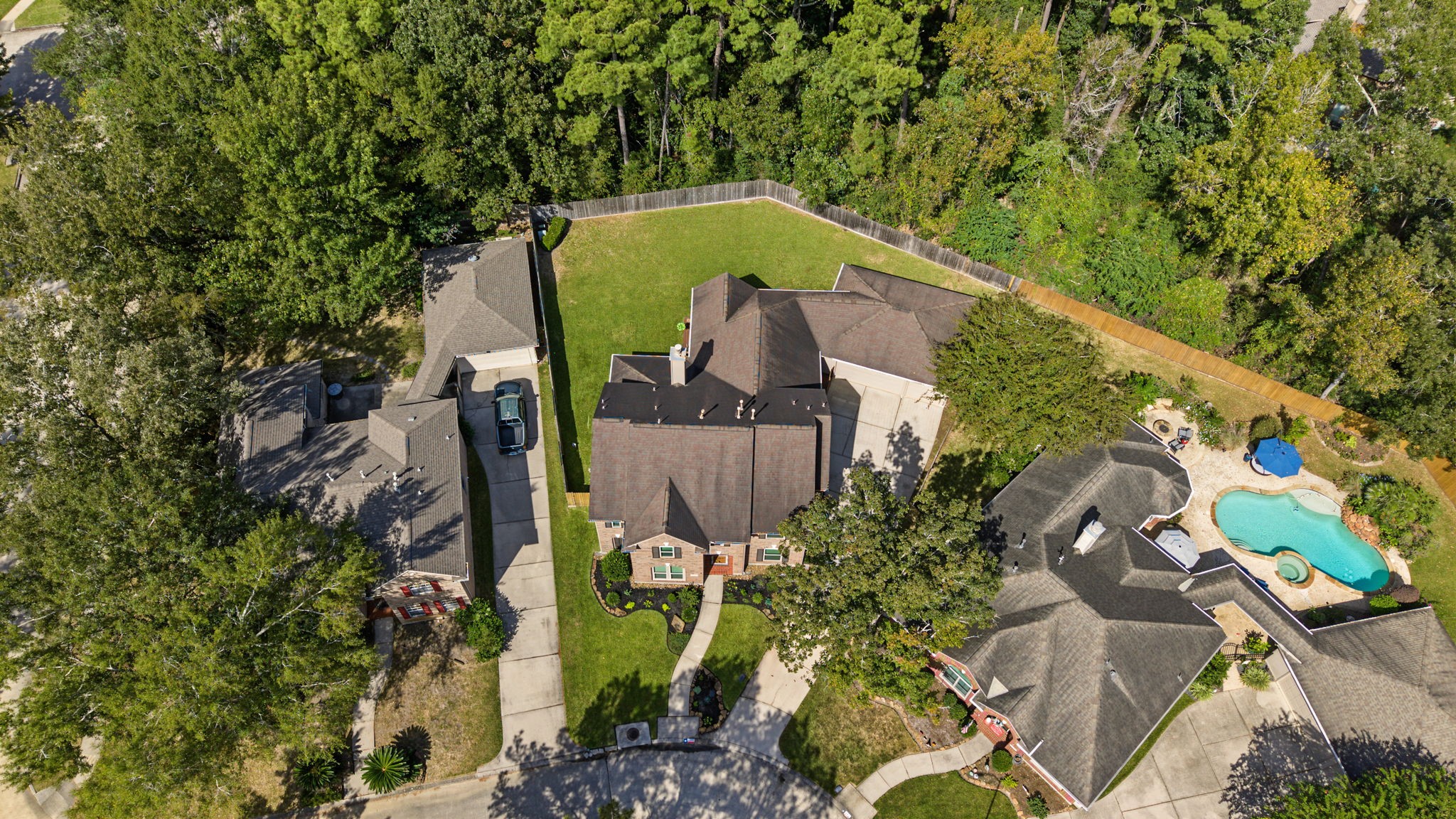 Aerial view showing the preserve of trees behind the back fence.