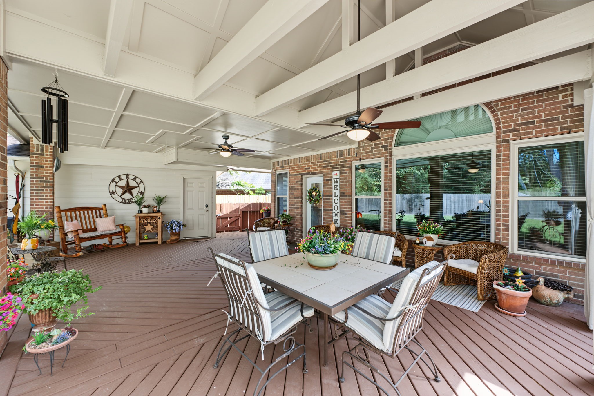 This section of the back patio has a vaulted ceiling and beams.