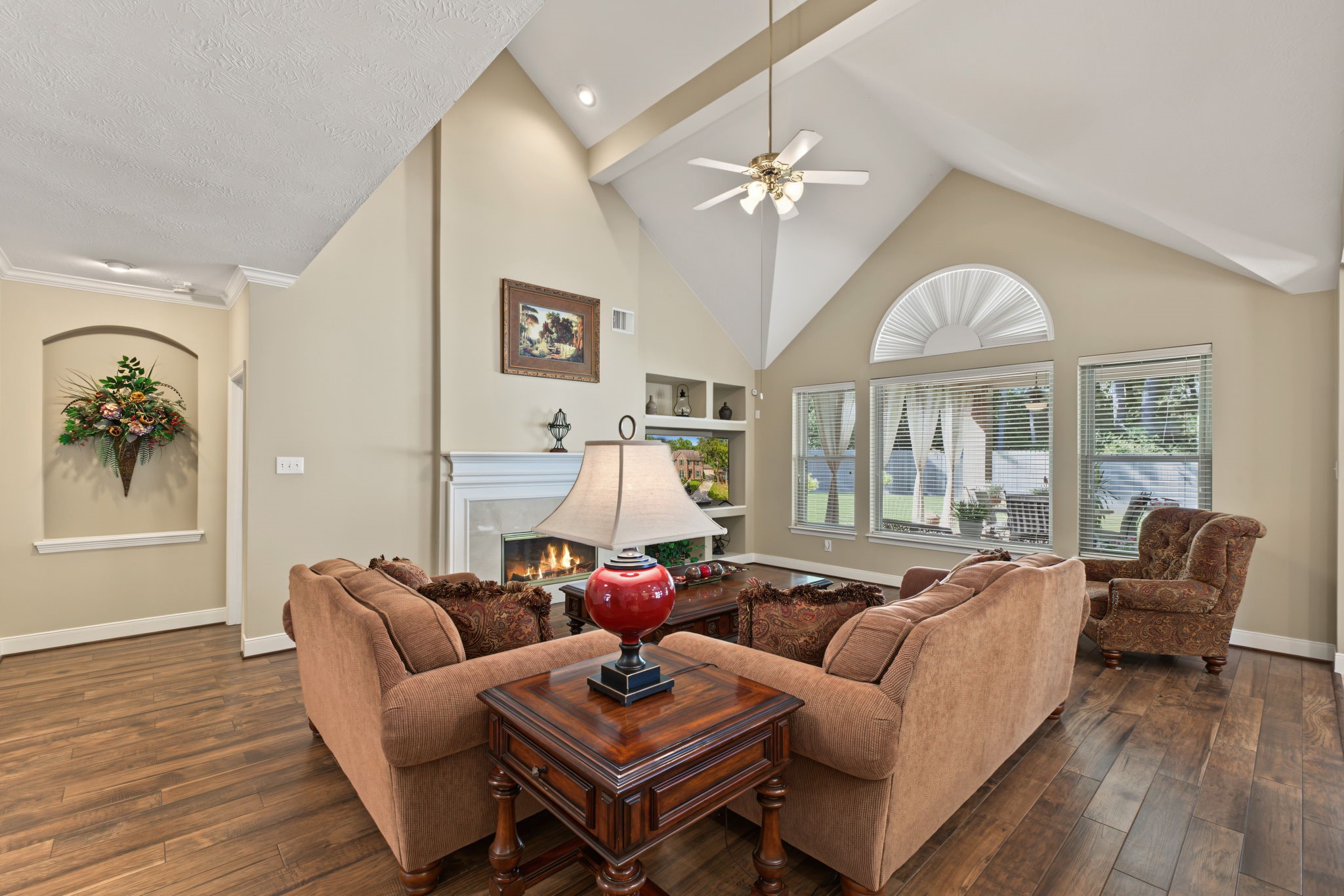 That lamp is plugged into an in-floor electrical outlet. The windows look out to the backyard.
