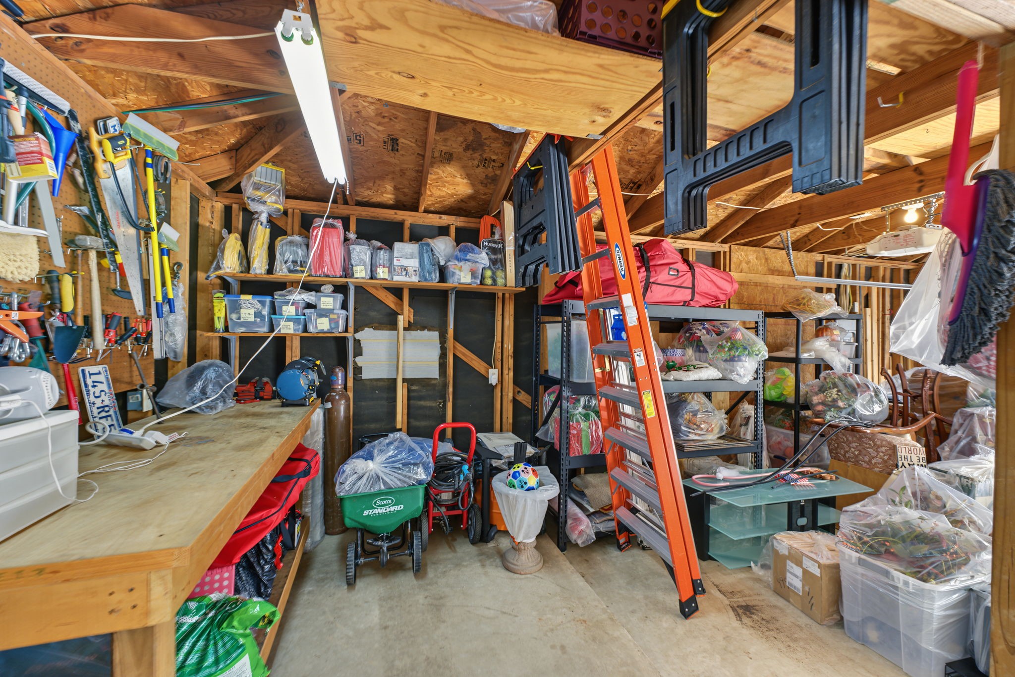 This is a workshop area in the back corner of the garage. There used to be a mini-split in that wall where the gray square is.