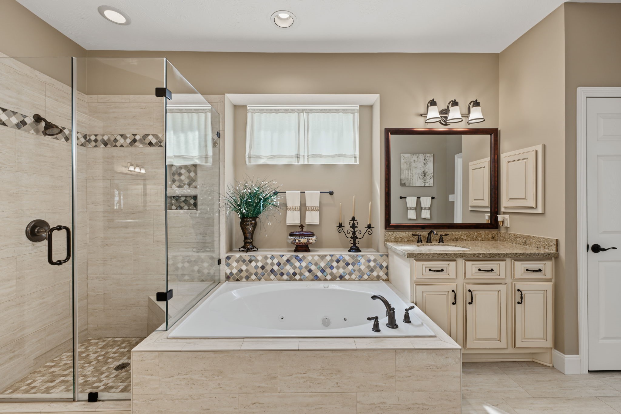 The Primary Bathroom has a separate shower and jetted tub area. His & Her closets too!
