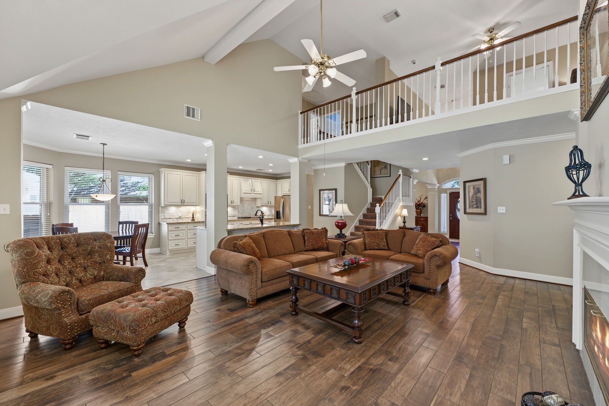 The Family Room is bathed in natural lighting and measures approx 22' x 17'.