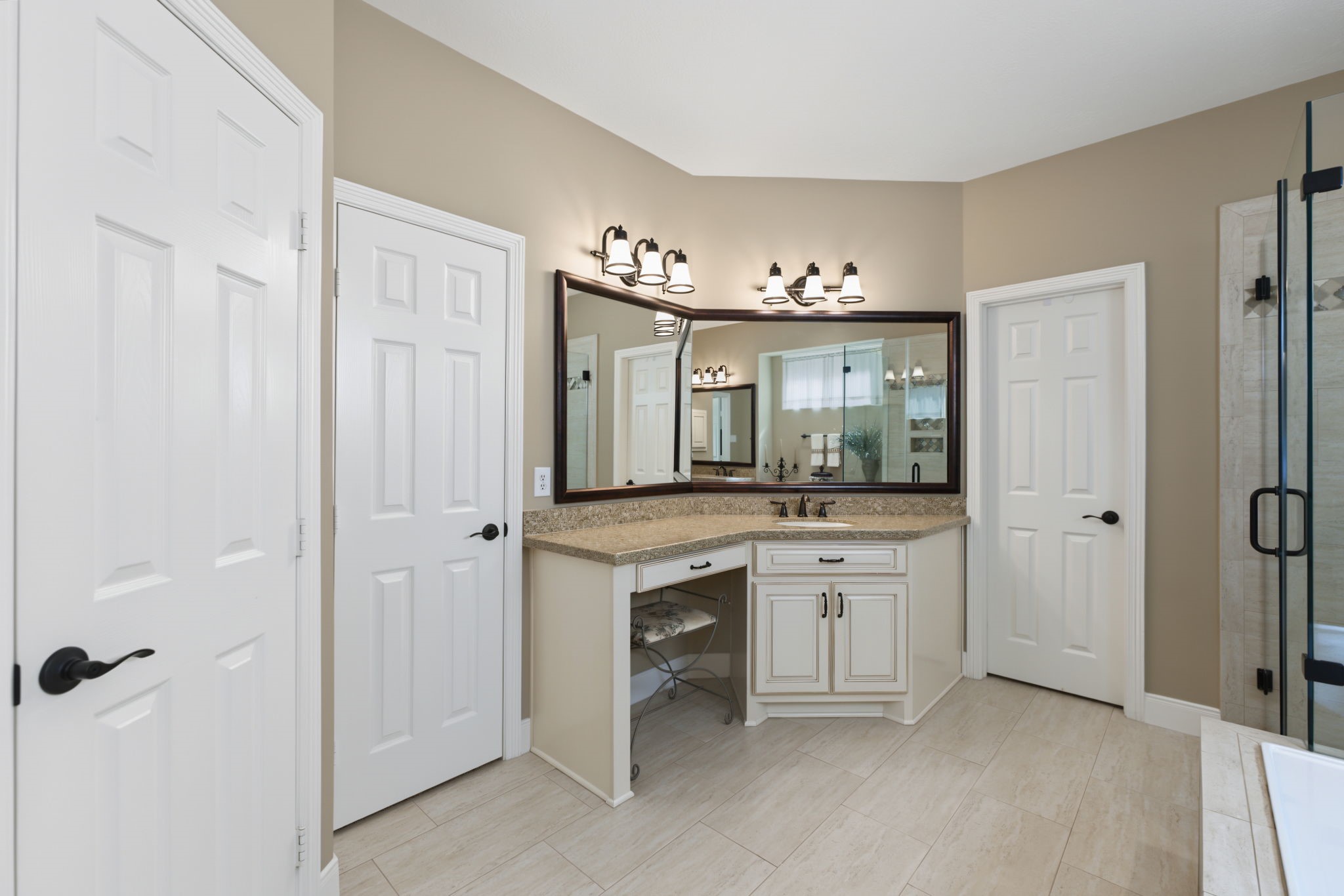 Door on the left leads to the toilet. Door in the middle is one closet and door on the right is another closet.
