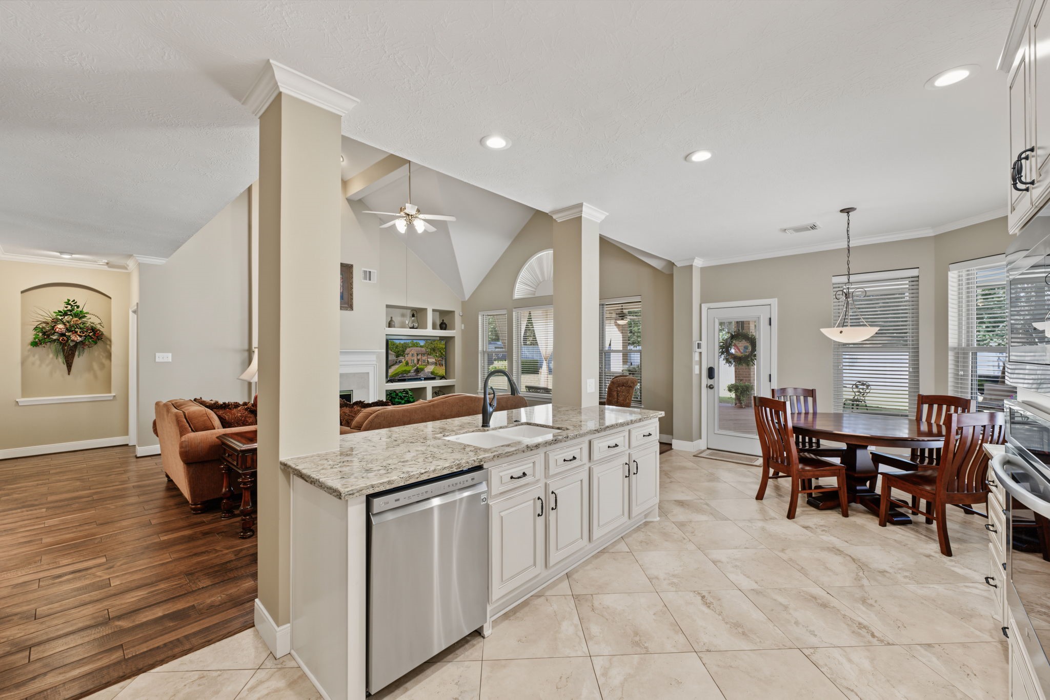 View from the kitchen fridge area showing the openness of the kitchen space and views into the Family Room.