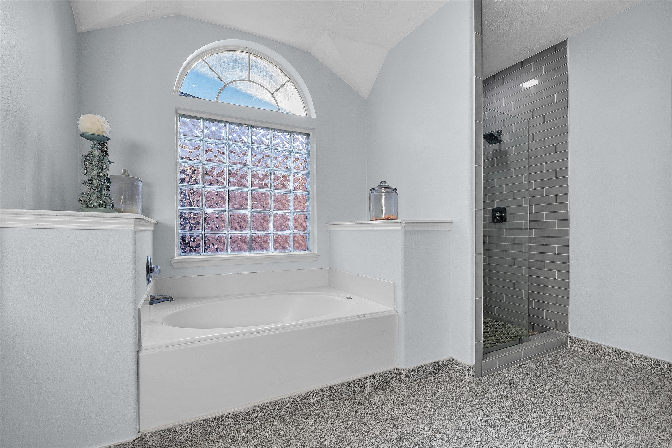 Featuring new tile, fixtures, and more this renovated bathroom is the perfect place to start and finish your day.