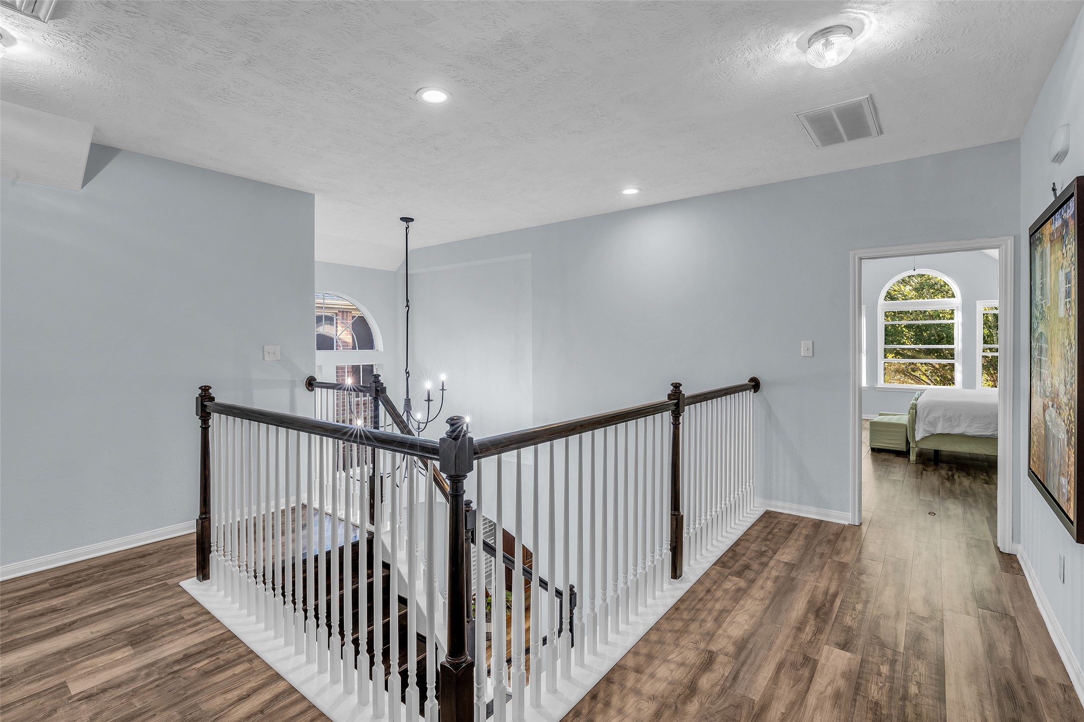 Updated Oak staircase leads us upstairs