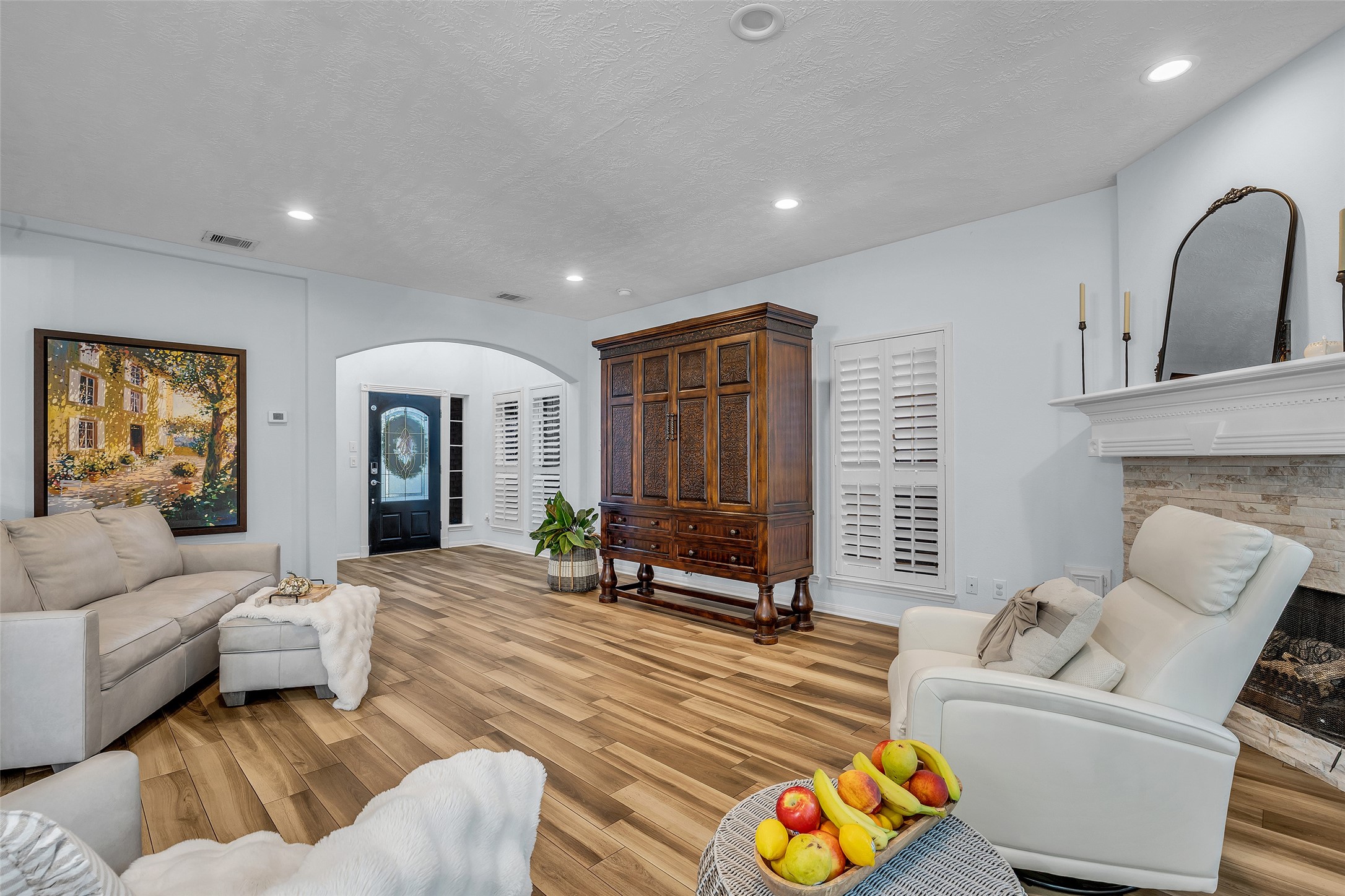 Recessed lighting and upgraded custom plantation shutters stand out as well as the grand mantle on this fireplace. Recessed lighting and upgraded custom plantation shutters stand out as well as the grand mantle on this fireplace.