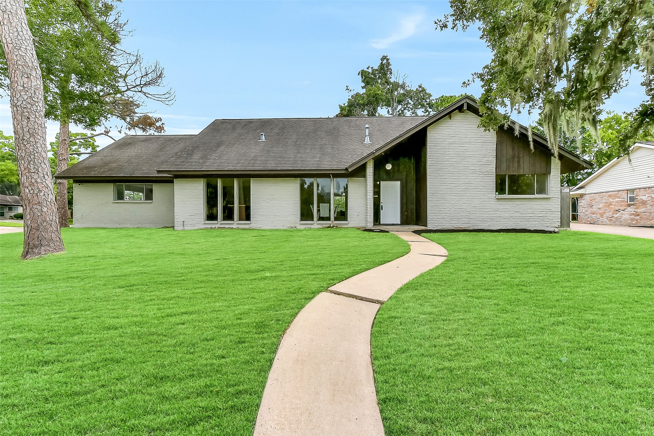 Situated on a large corner lot with a high elevation in the established Wedgewood Village community, this two-story 5-bedroom home is framed by towering, moss-draped trees and offers a park like setting within the boudaries of CCISD.