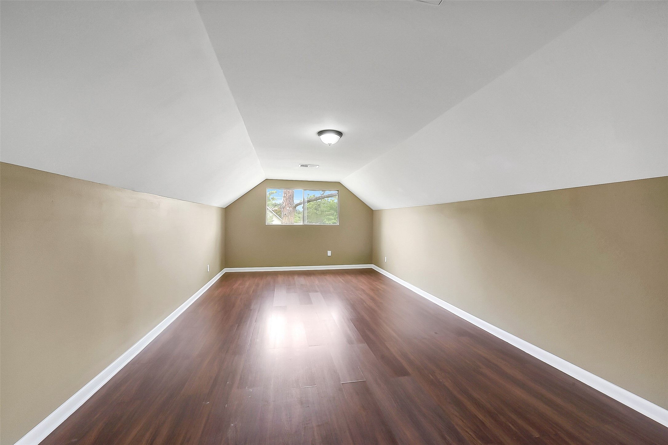 Upstairs flex-use bonus room offers endless possibilitiesideal for a media room, playroom, home office, or gym.