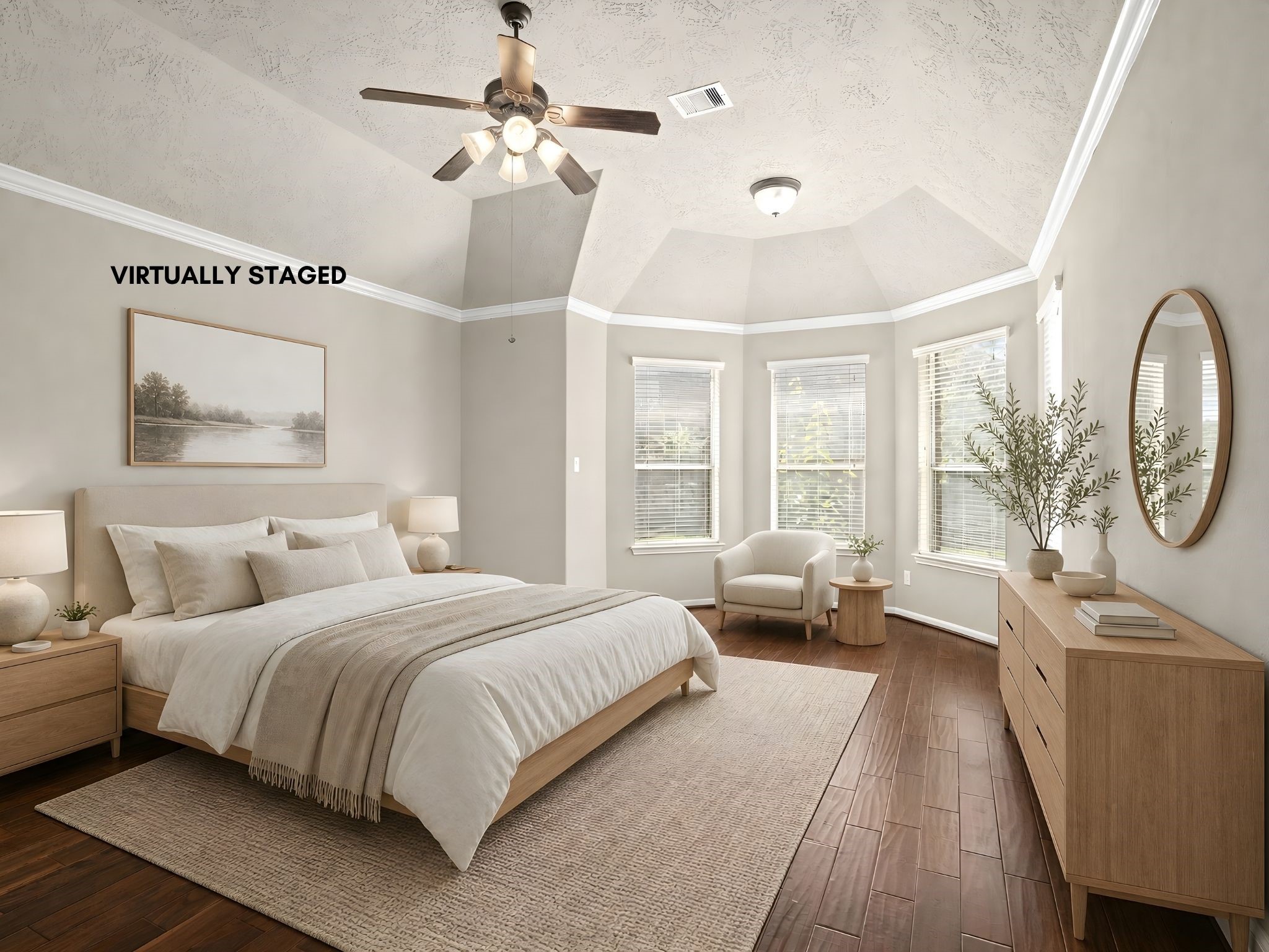 Retreat to the expansive primary suite, where rich wood flooring, soaring ceilings, a ceiling fan, and elegant double doors create a serene private sanctuary.