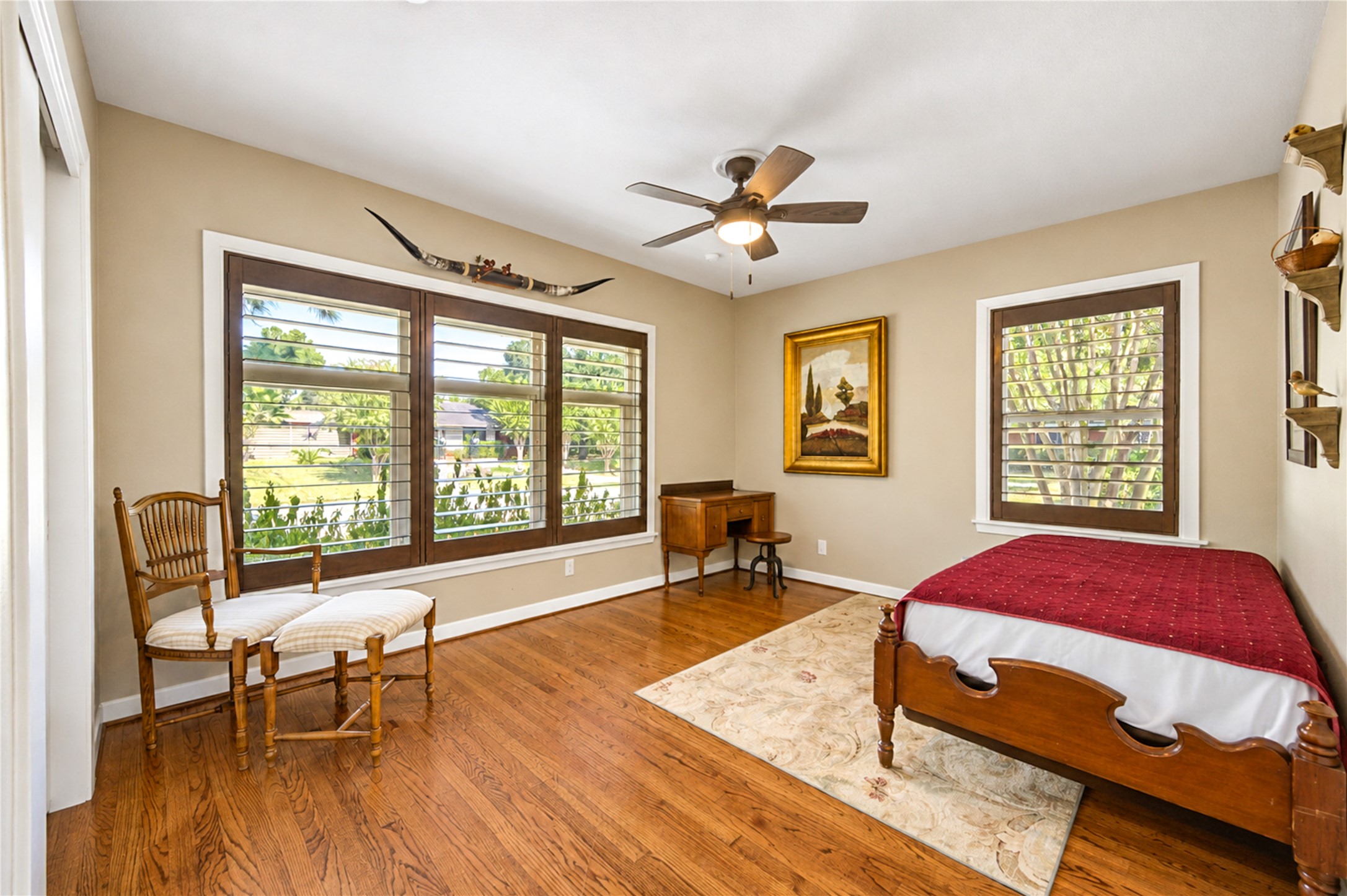 Expansive windows overlook the sparkling pool, bringing natural light and beautiful backyard views into the breakfast area.