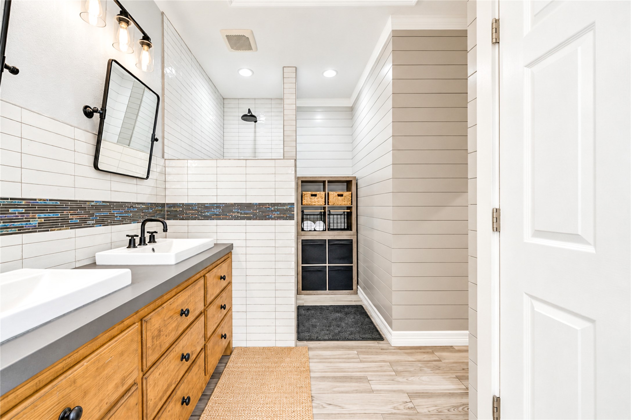 Wood-framed glass doors open the primary bedroom to the pool terrace, with a ceiling fan and generous closet storage.