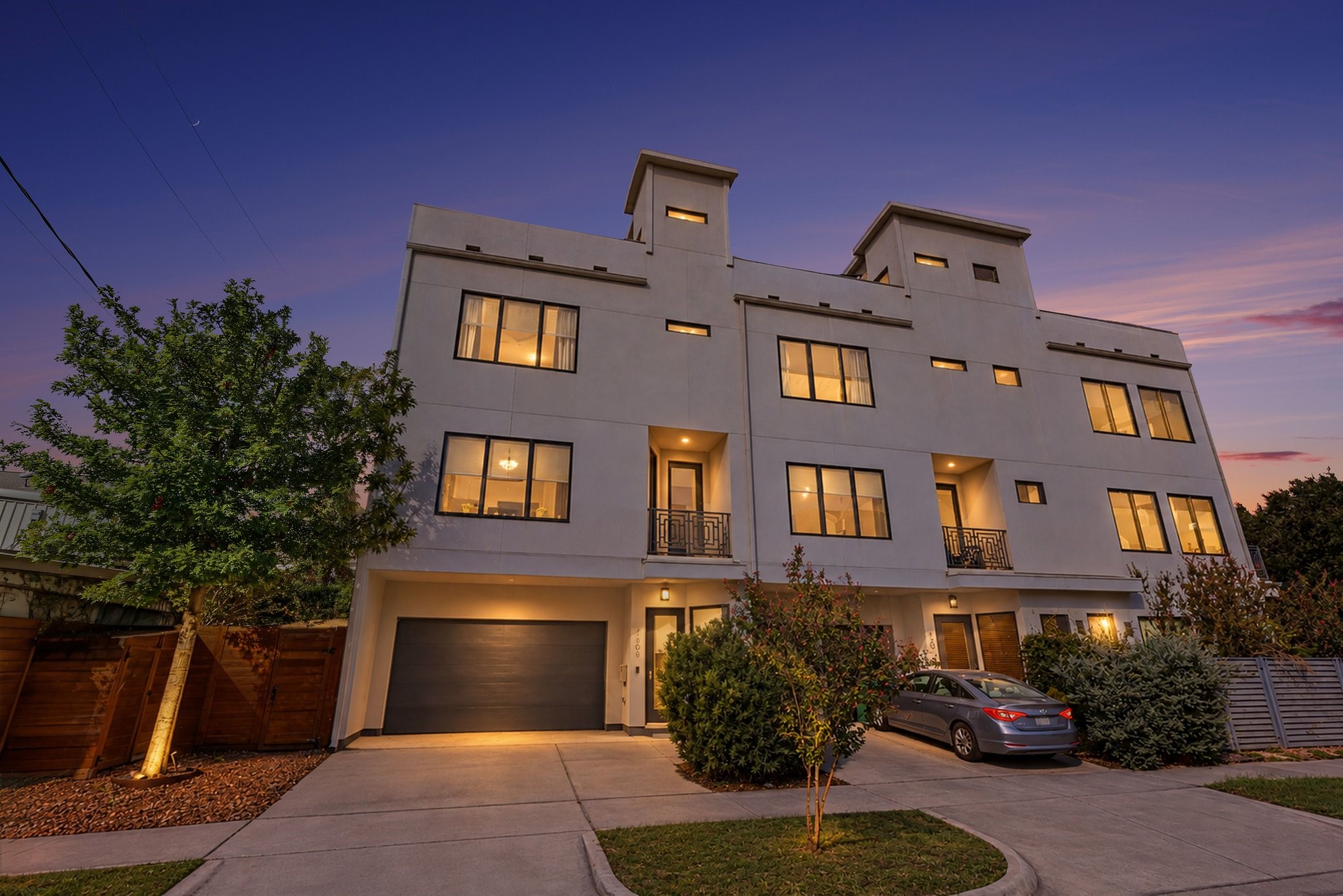 Located at 1808 Taft Street, this striking multi-level contemporary residence showcases bold geometric architecture characterized by clean lines, a smooth light-gray stucco facade, and distinctive rooftop tower volumes. Located at 1808 Taft Street, this striking multi-level contemporary residence showcases bold geometric architecture characterized by clean lines, a smooth light-gray stucco facade, and distinctive rooftop tower volumes.