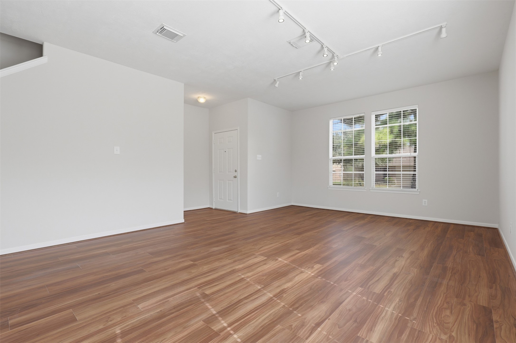 Welcoming formal living and dining area greets you upon entry, featuring brand-new LVP flooring, fresh paint, and great natural light. The thoughtfully defined space offers a comfortable separation from the family room and kitchen areas while maintaining an open, inviting feel.