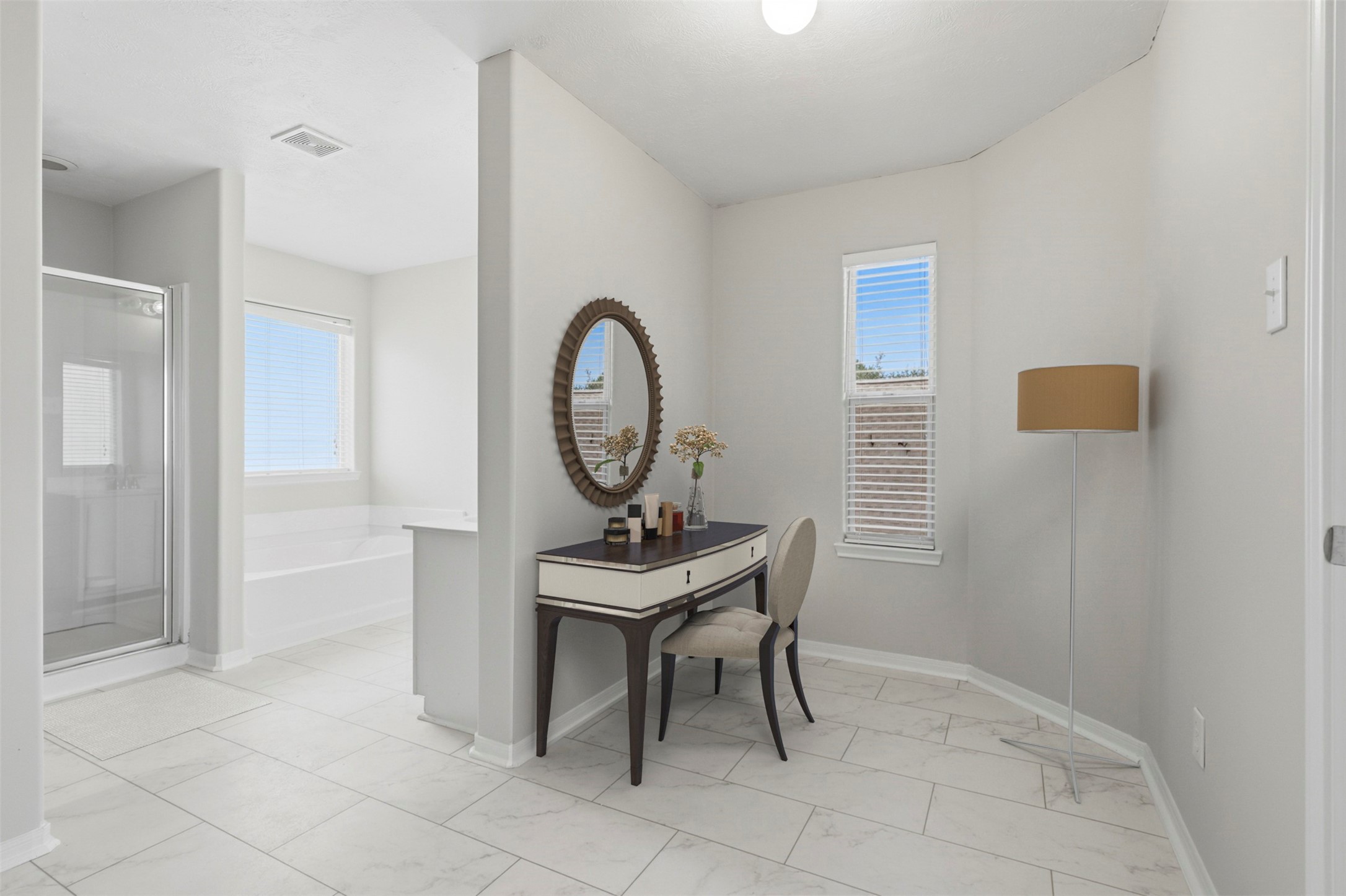 Virtually staged to showcase one of the many possibilities for this space in the primary bathroom, illustrated here as a vanity area.