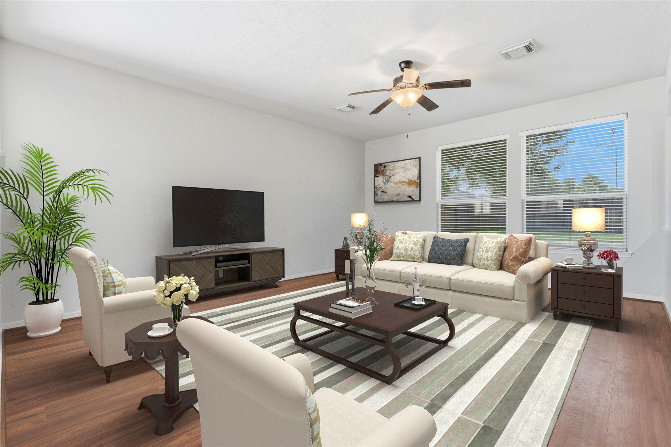 Virtually staged photo illustrating the potential layout of the family room that sits right off the kitchen.