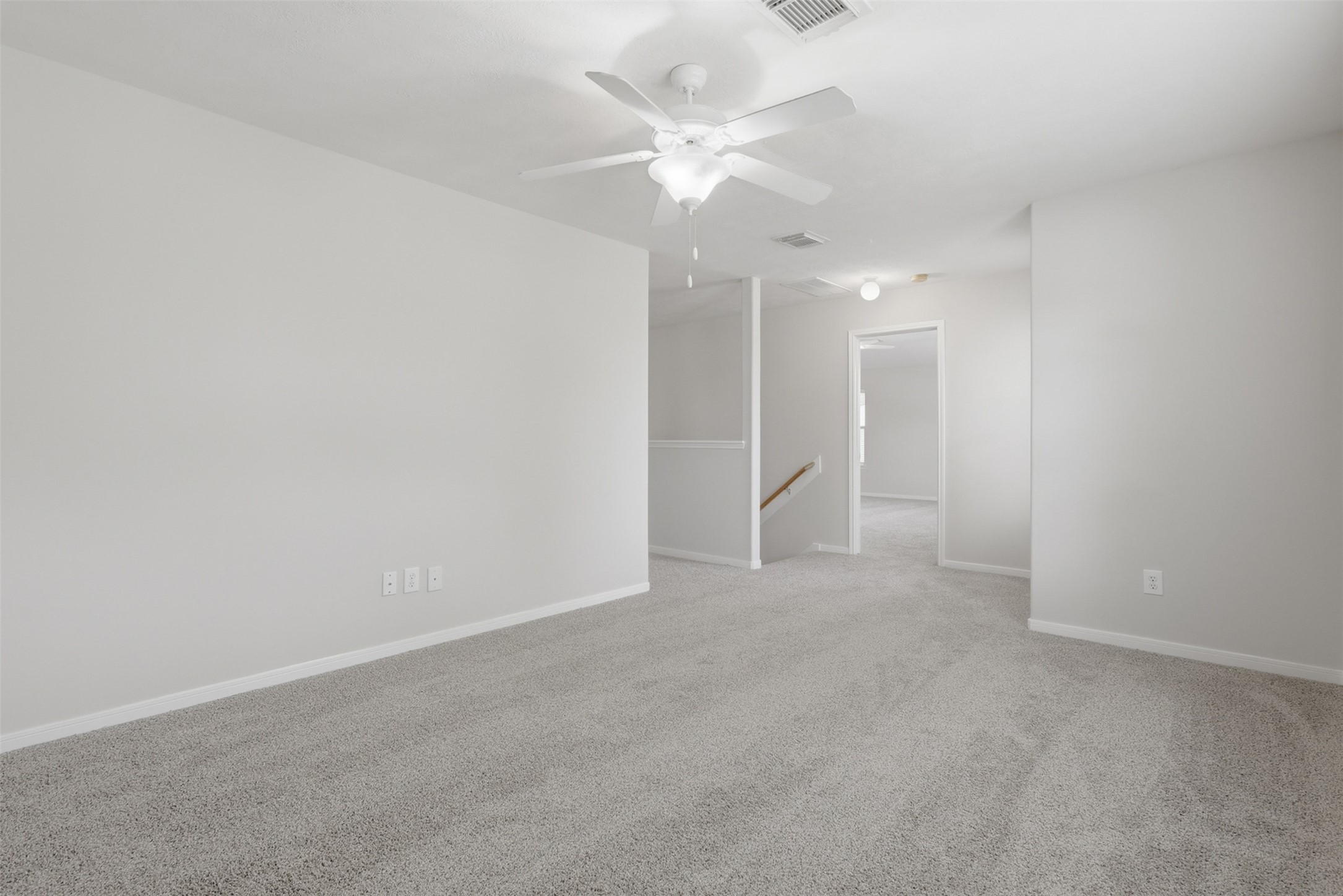 Spacious gameroom on the 2nd floor featuring fresh paint and brand new carpetready for your personal touch!