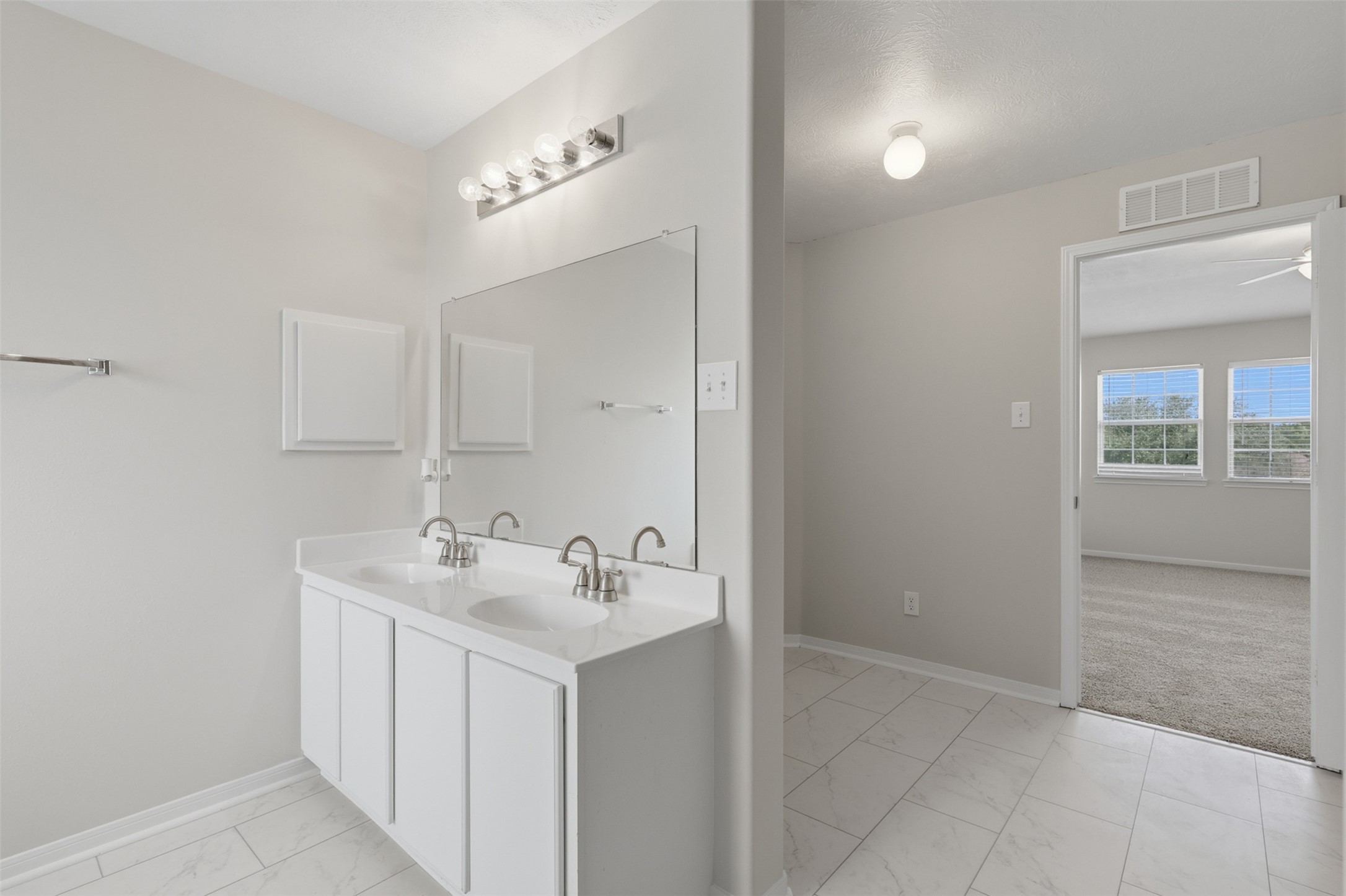 Alternate view of primary en-suite bathroom.