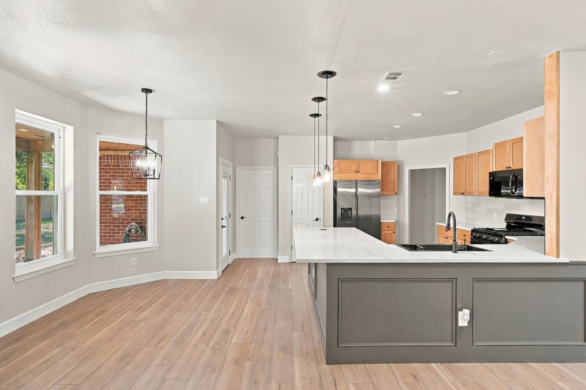 This updated kitchen will be your home chef's dream! Updated quartz countertops, updated lighting, recently replaed appliances, updated lighting and recently replaced cabinets!