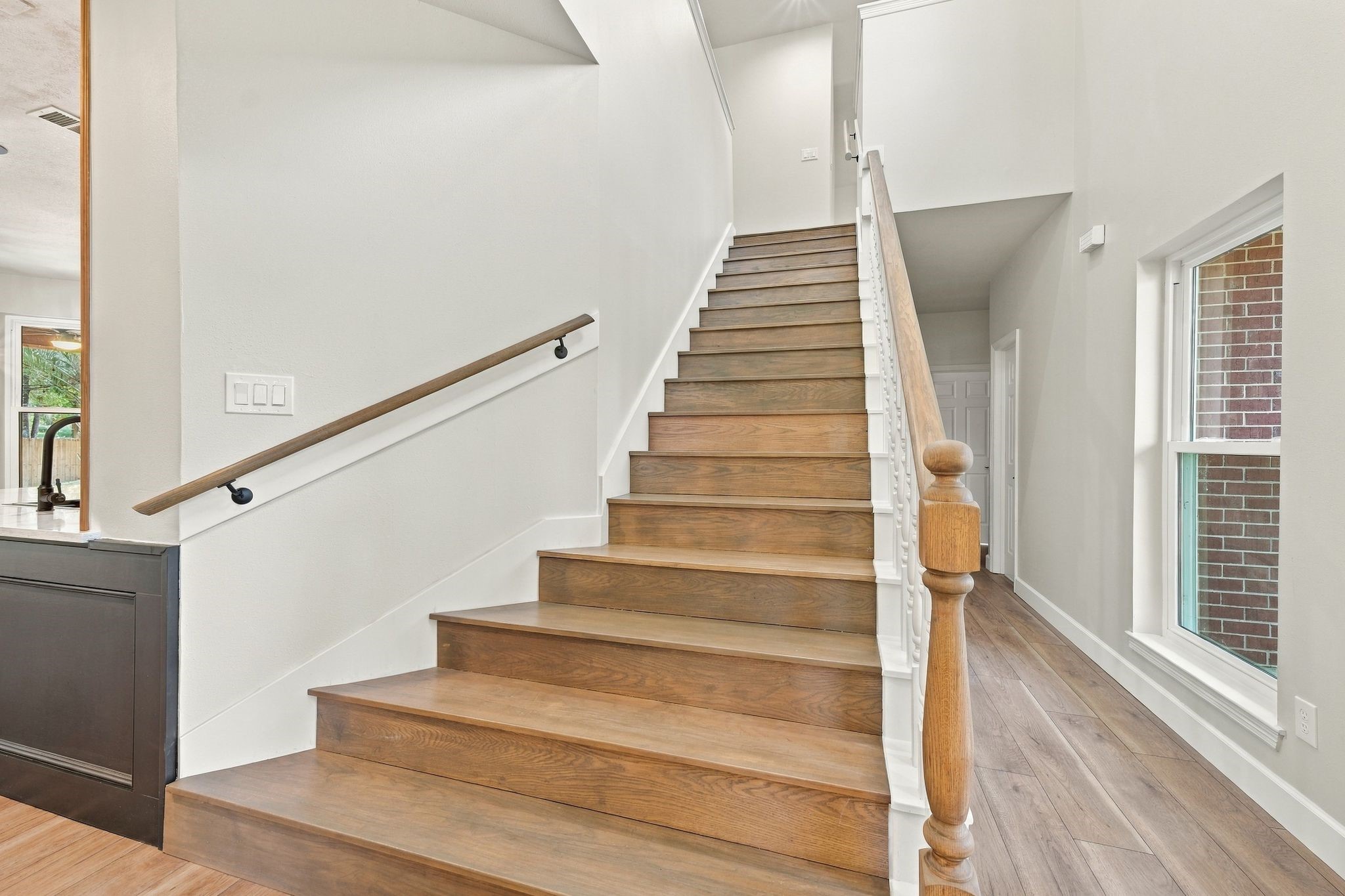 Let's head upstairs! Notice even the stairs have updated flooring!