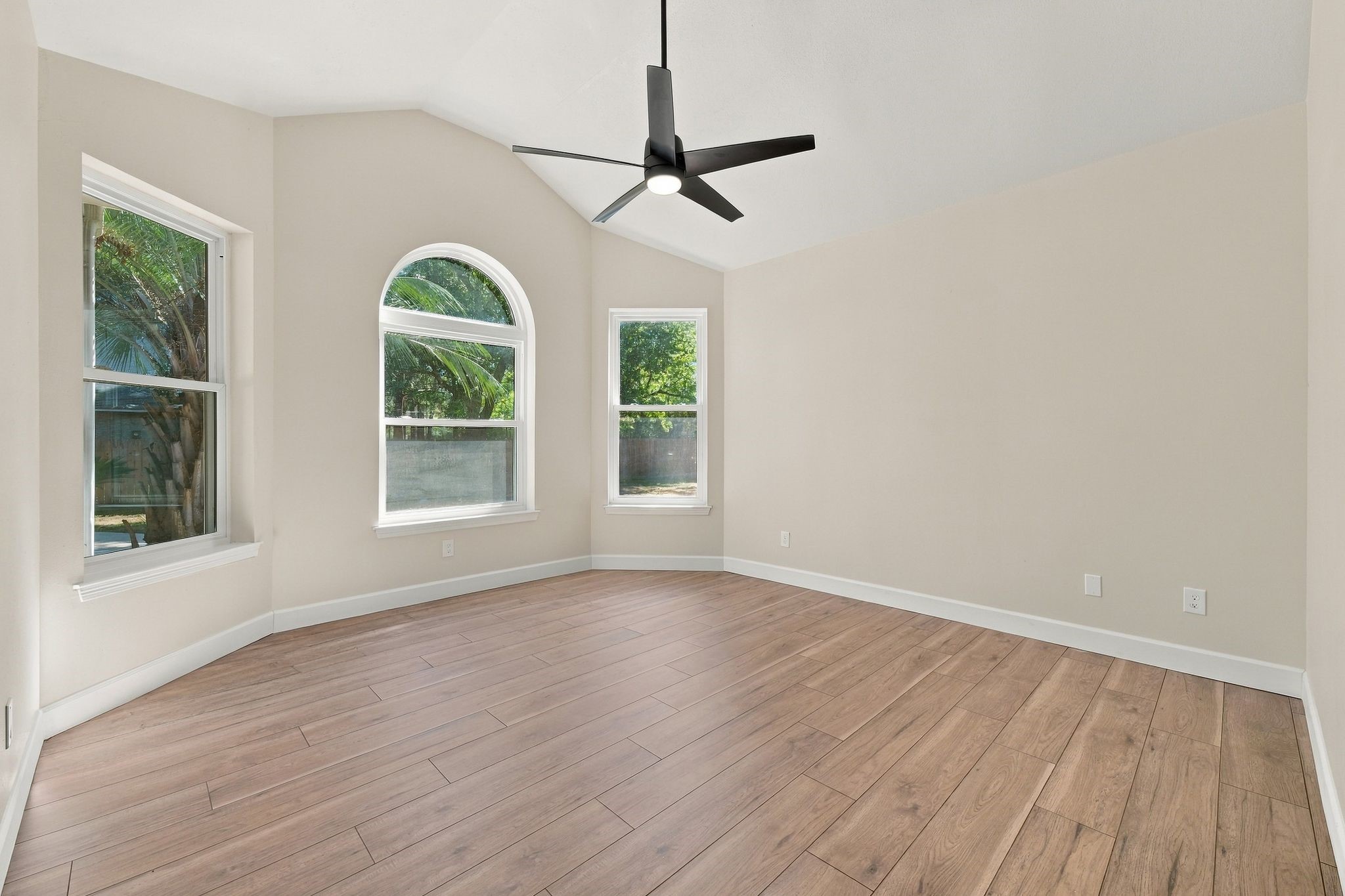The primary bedroom is downstairs just off of the breakfast room! It has updated flooring, lighting, fan and paint!