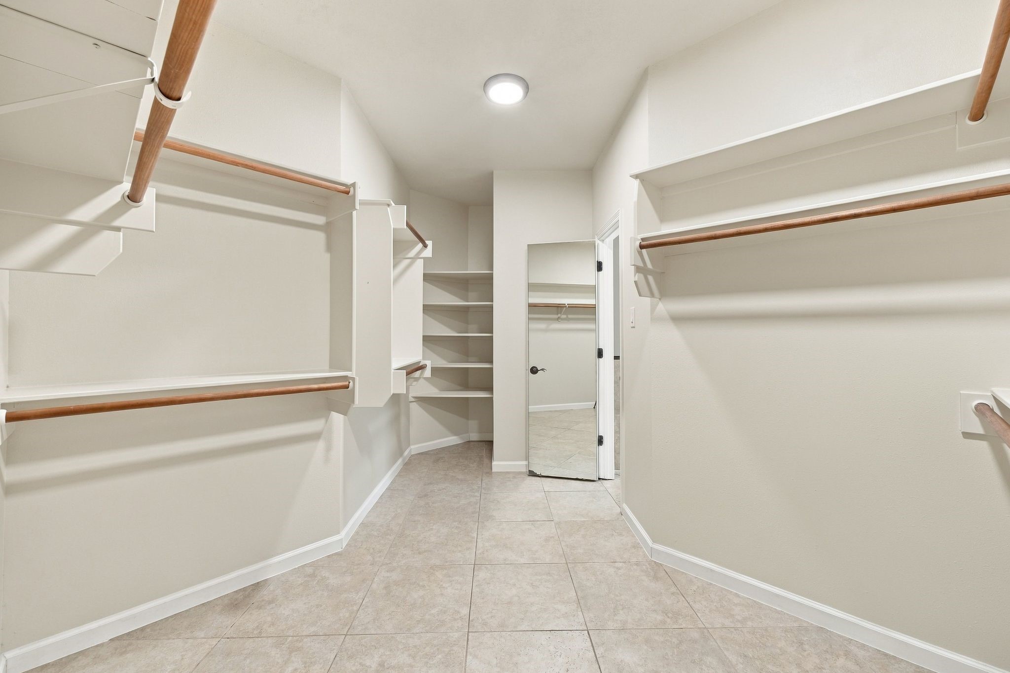 This primary walk in closet just keeps on going!