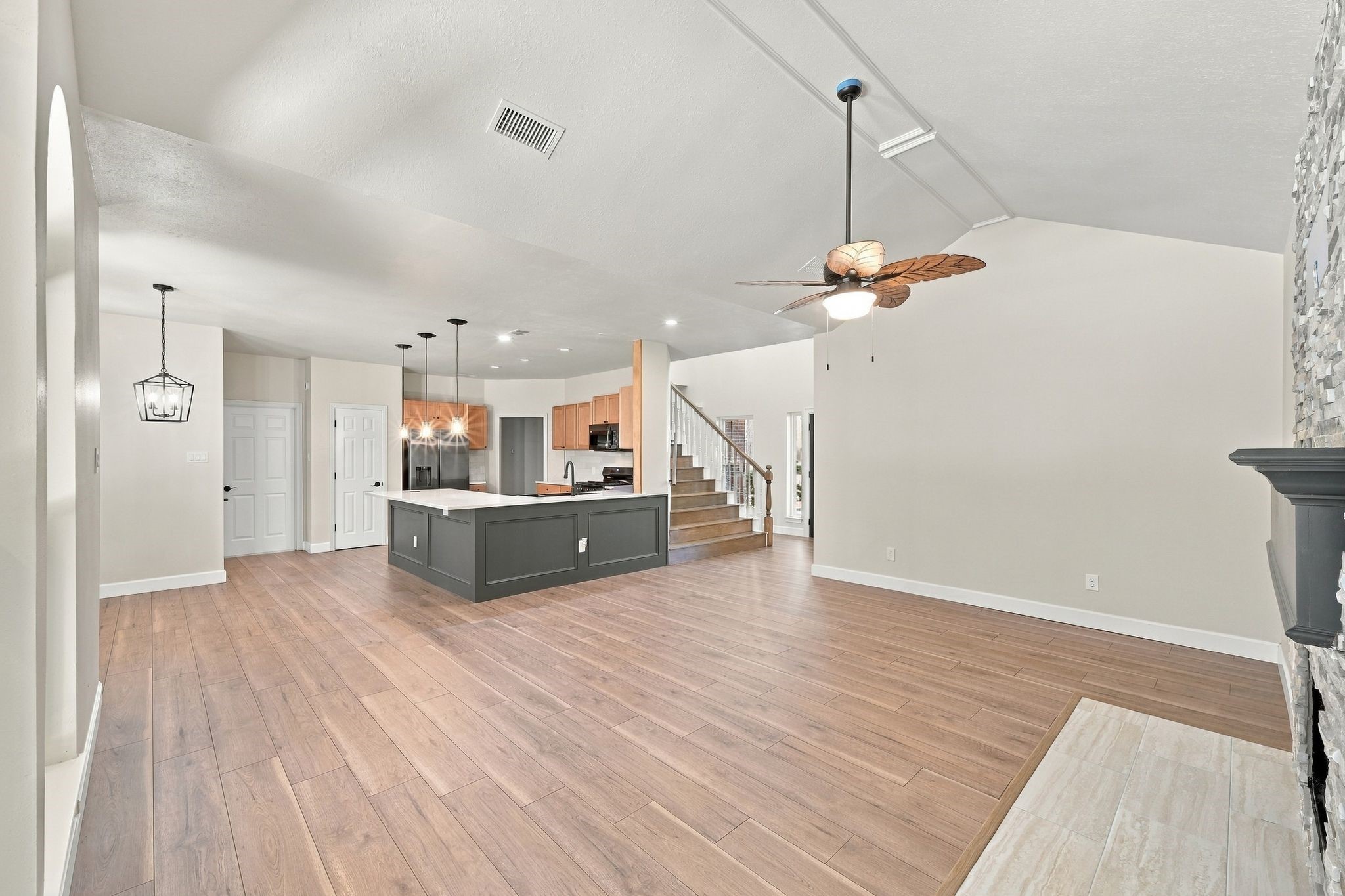 This is a great look from across the open living room straight into the updated kitchen and breakfast room!