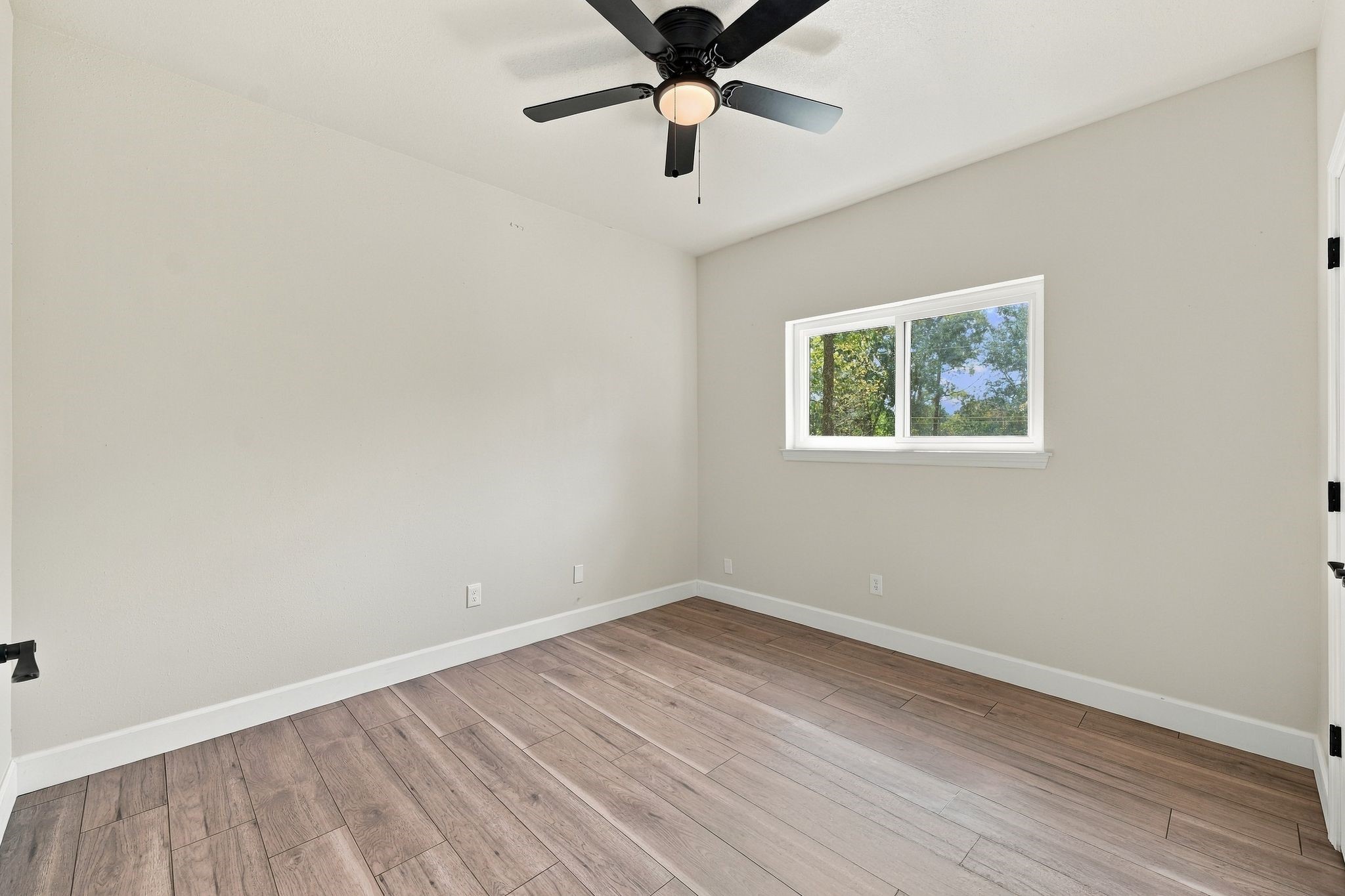 This is another secondary bedroom upstairs, also with updated flooring and lighting!
