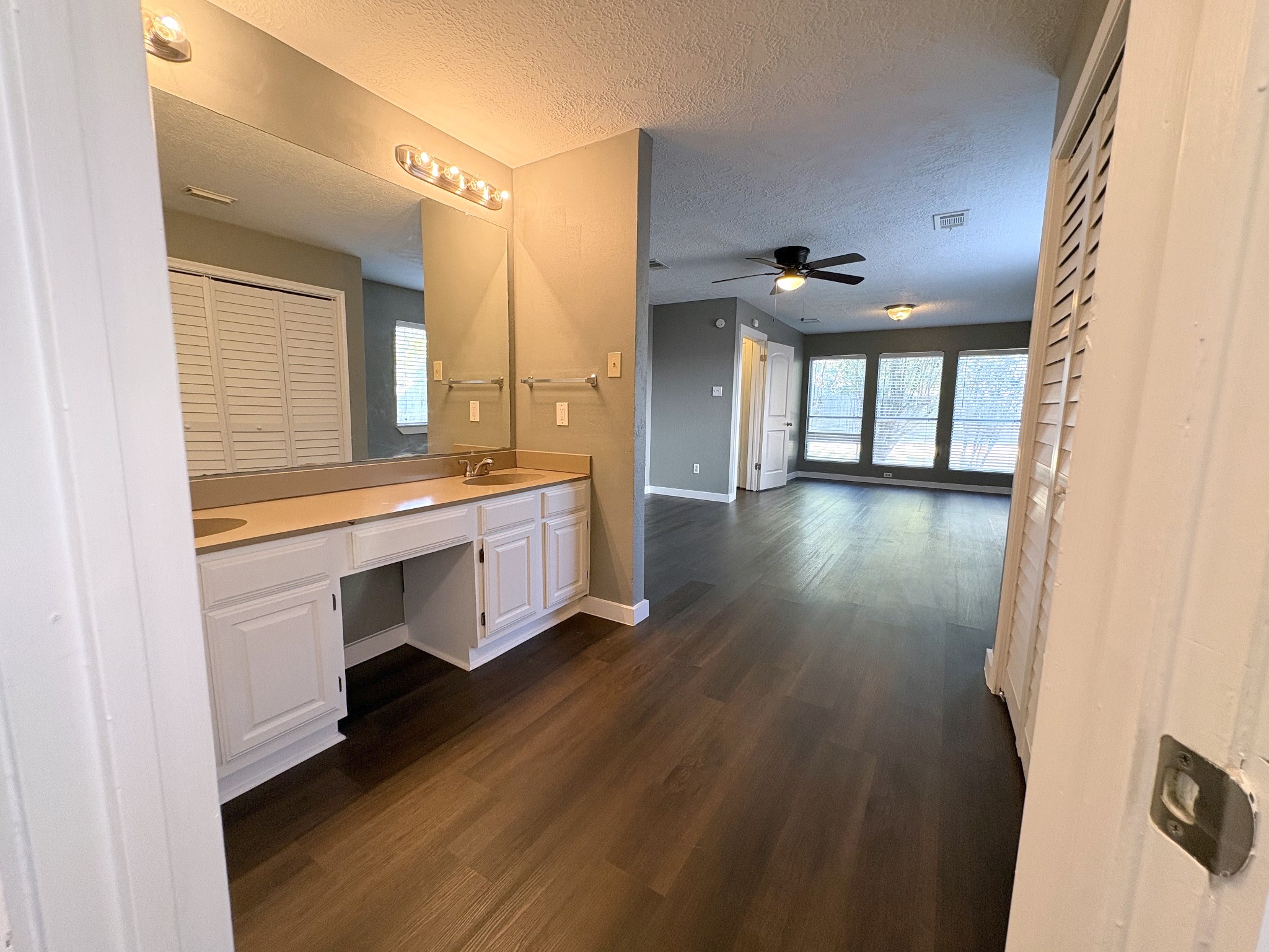 View from the bath/closet area to the primary bedroom