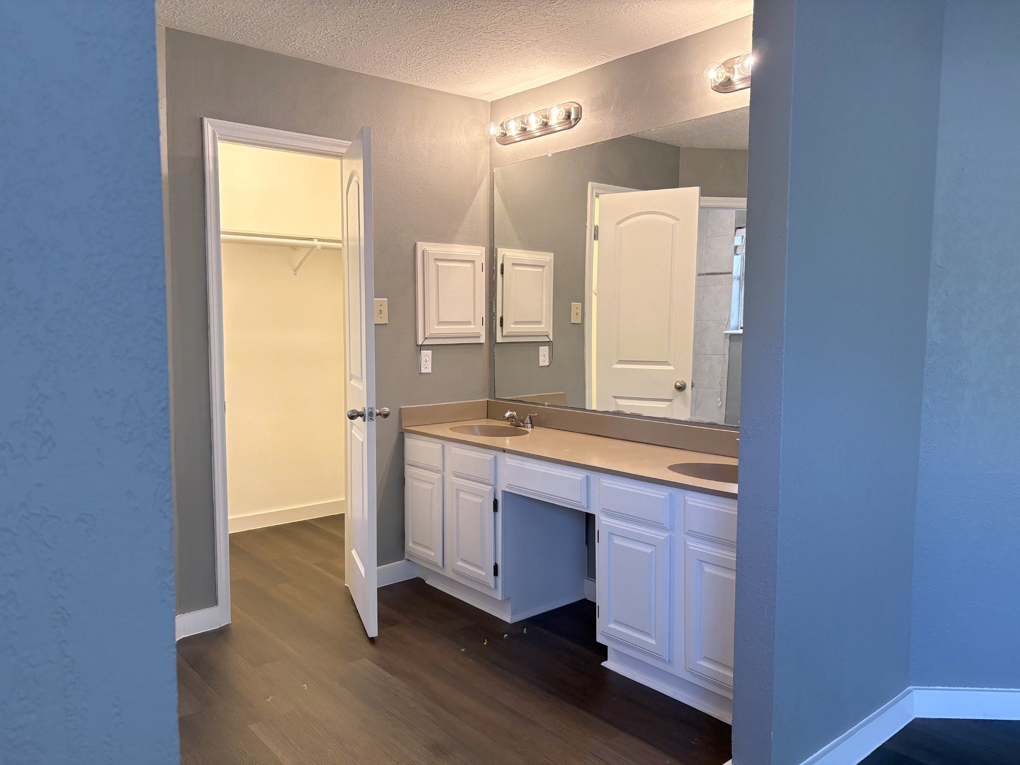 A spacious vanity with dual sinks makes getting ready a breeze
