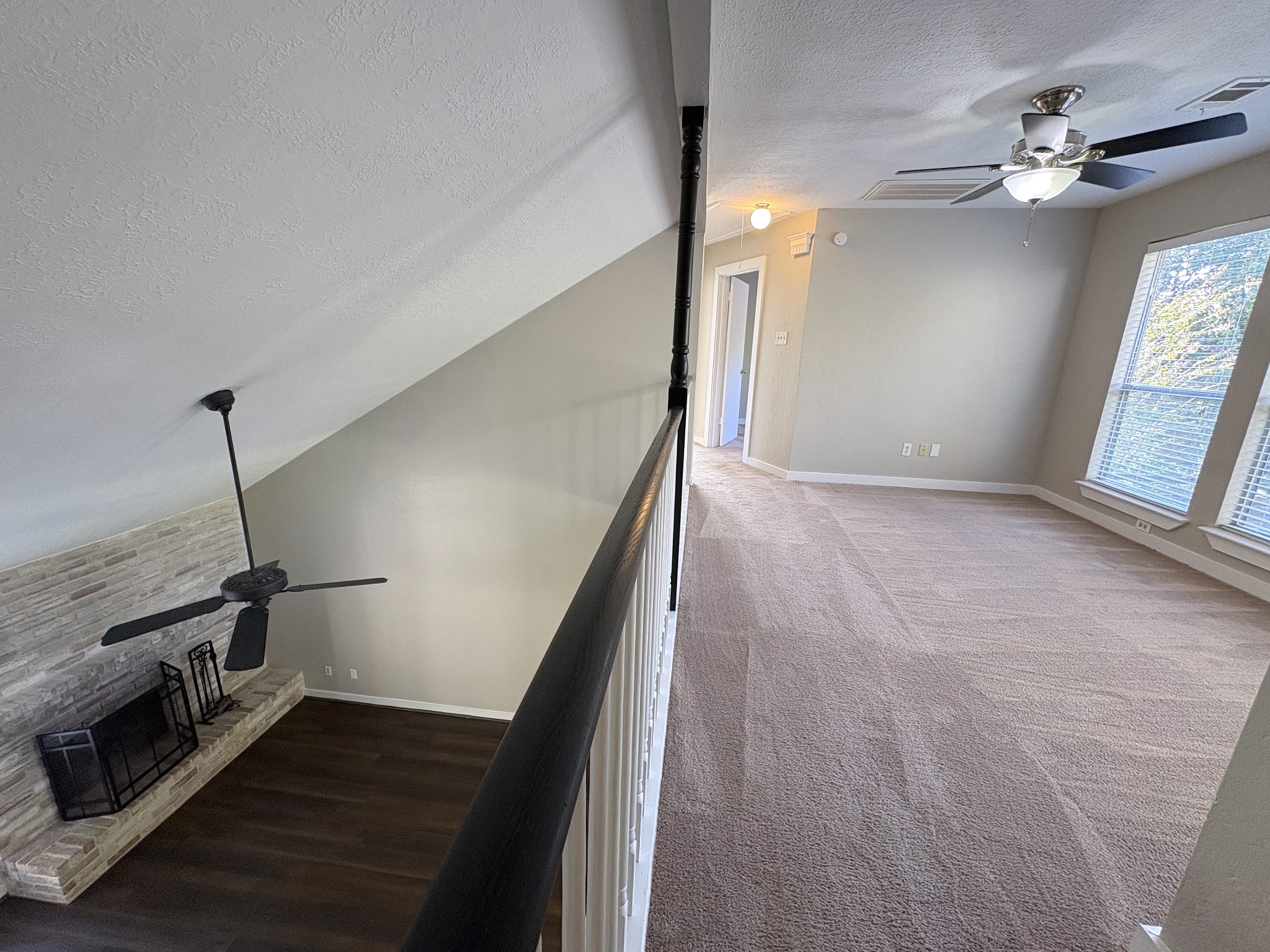 An open loft overlooks the living area below