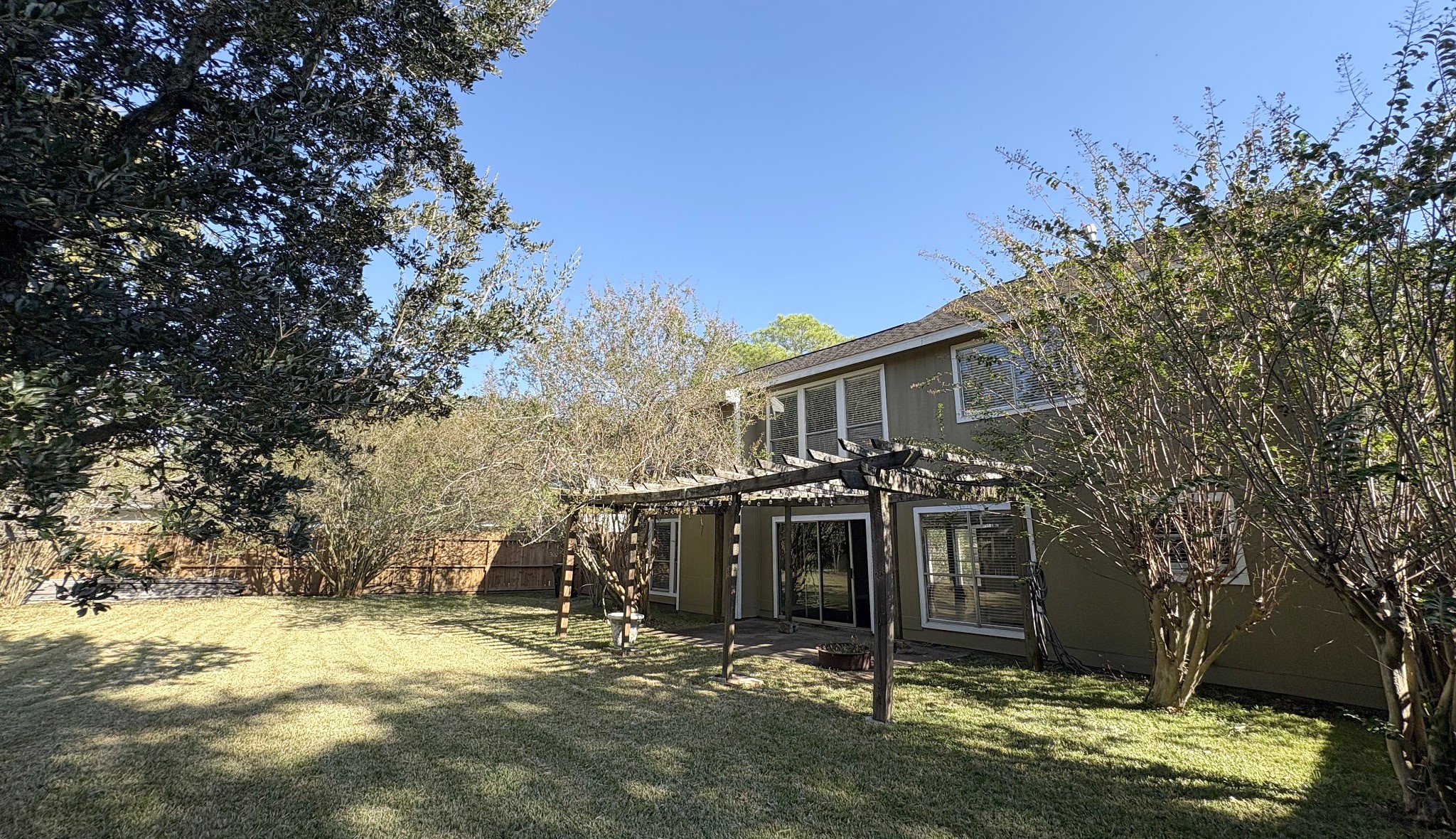 Enjoy this spacious retreat with plenty of shade and room to play