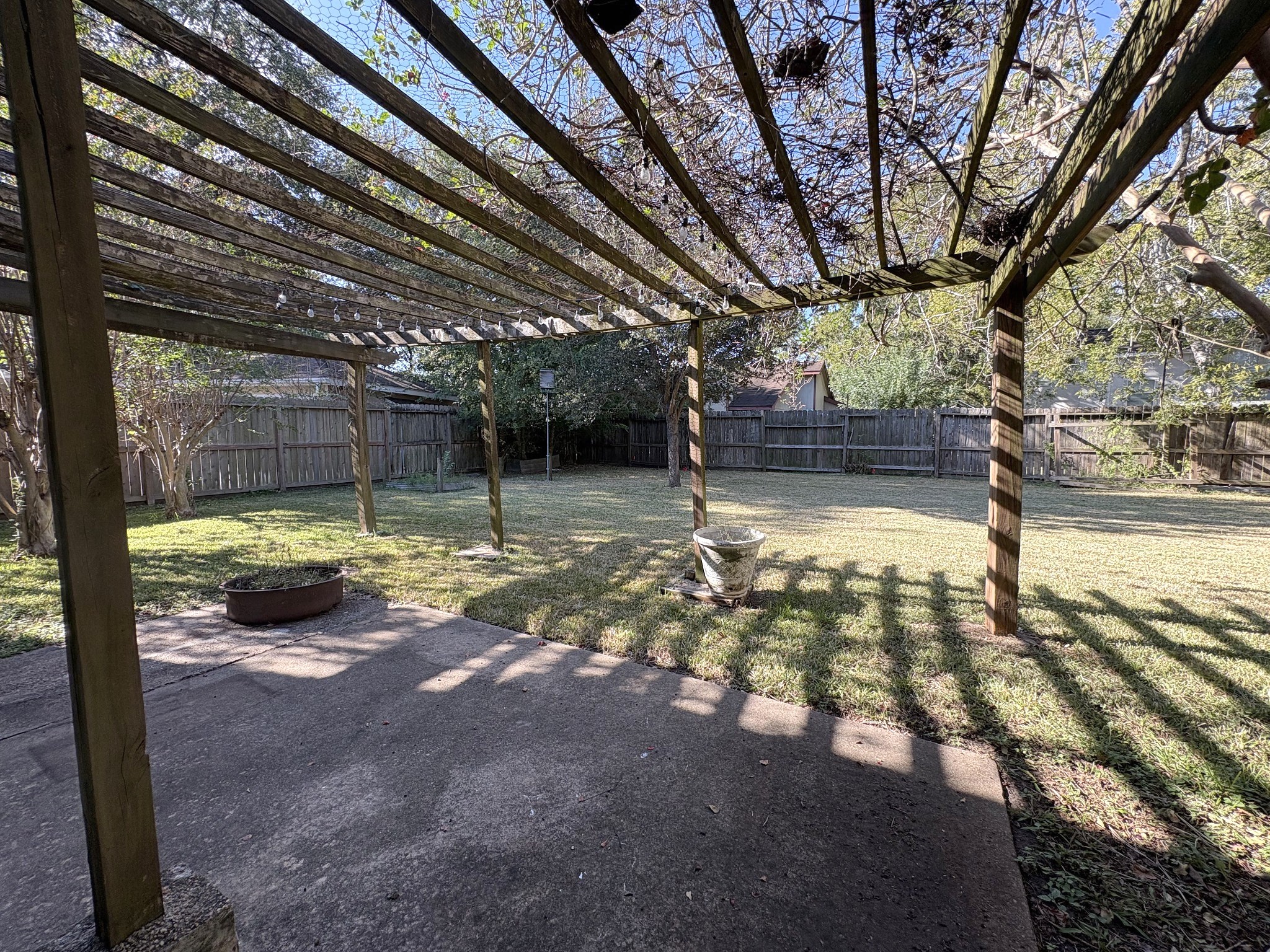 Pergola over the back patio contributes a calming ambience