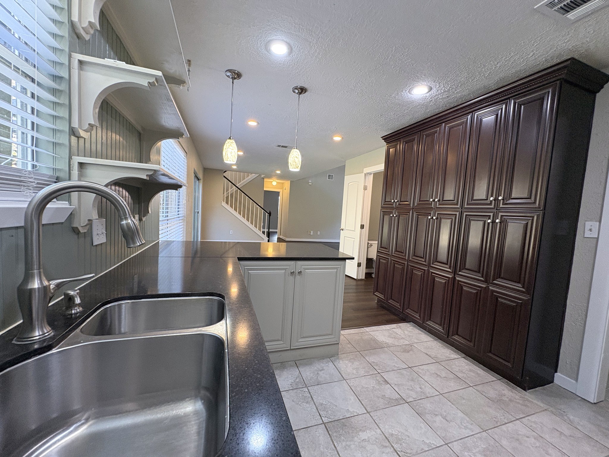 Plenty of storage in the beautiful wood cabinets