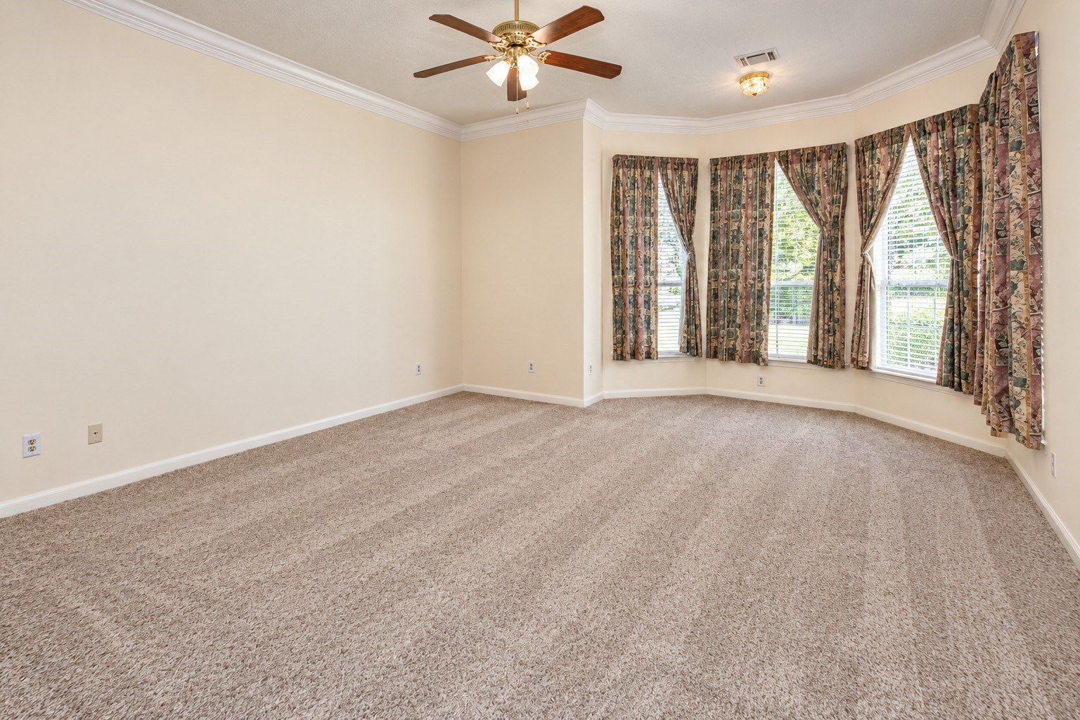 Large Primary Bedroom with new carpet