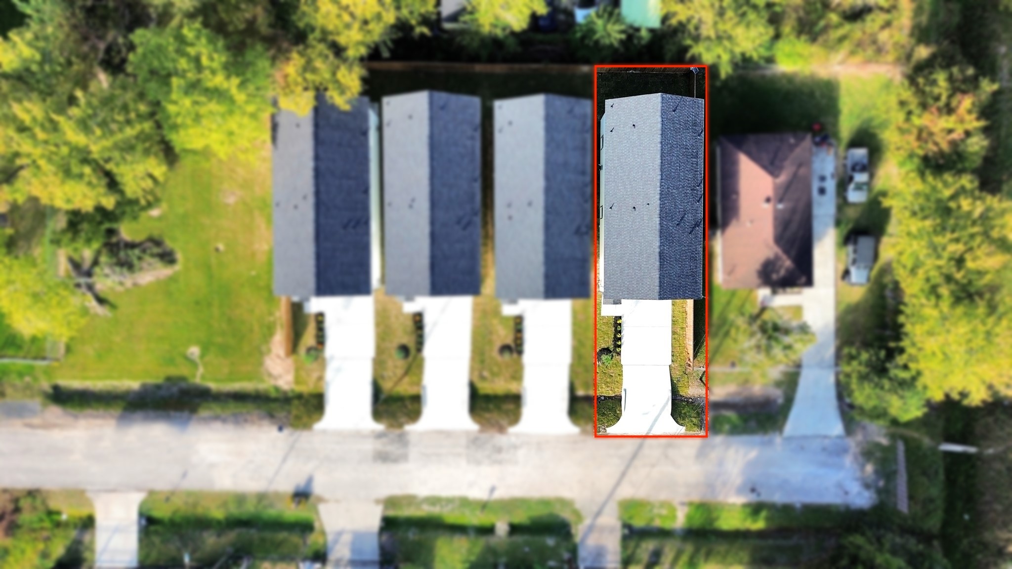 Overhead aerial view showcasing the four newly completed homes at 6671, 6673, 6675 & 6677 Nielan St, highlighting their matching architectural designs, individual driveways & property layouts.