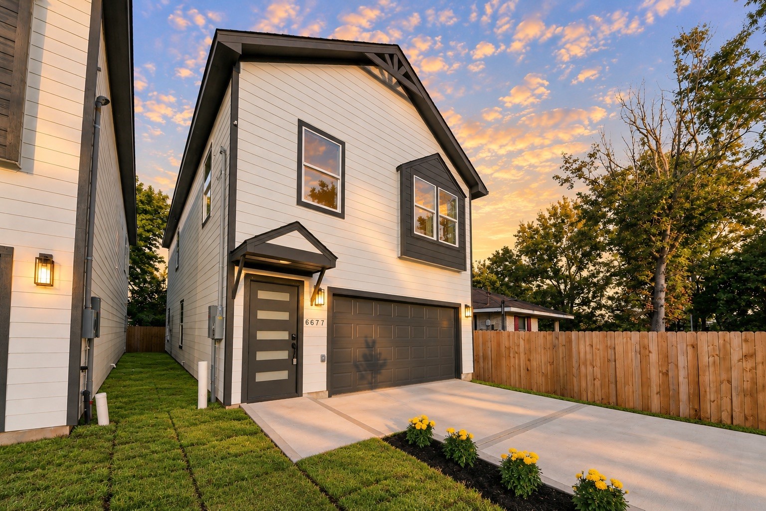 Beautiful front elevation showcasing the home's modern design, decorative exterior accents, covered entry, contemporary front door & spacious 2-car garage. Beautiful front elevation showcasing the home's modern design, decorative exterior accents, covered entry, contemporary front door & spacious 2-car garage.