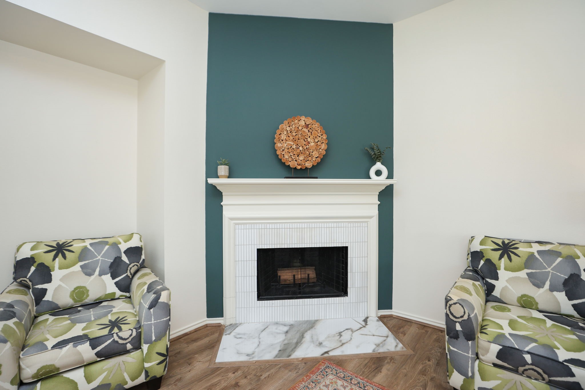 Home features a beautiful redesigned fireplace to gather around. Vertical channel set tile surround with a large marble tile hearth. All new light fixtures add to the brand new feel of this great home.