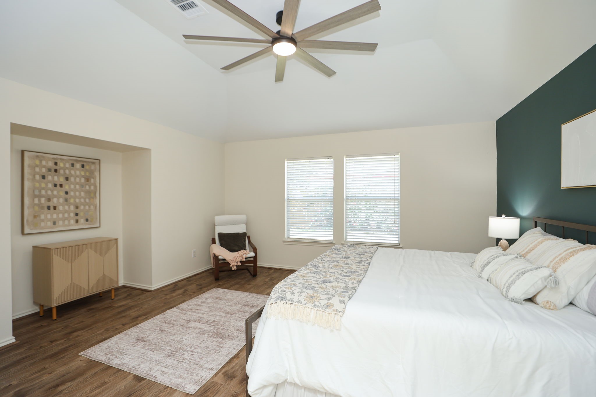 Another view of the primary bedroom showing the inset wall for bedtime TV watching or a dresser. Large enough to accommodate a king size bed (present now) and seating.