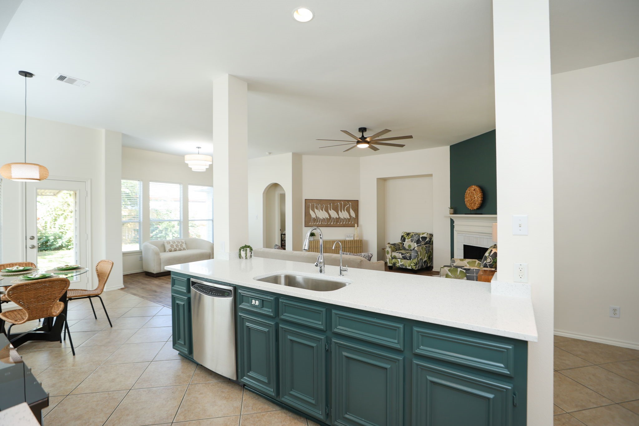 Home is accented with "Hidden Gem", the "color of the year" with an otherwise light palette to suite any decor.
