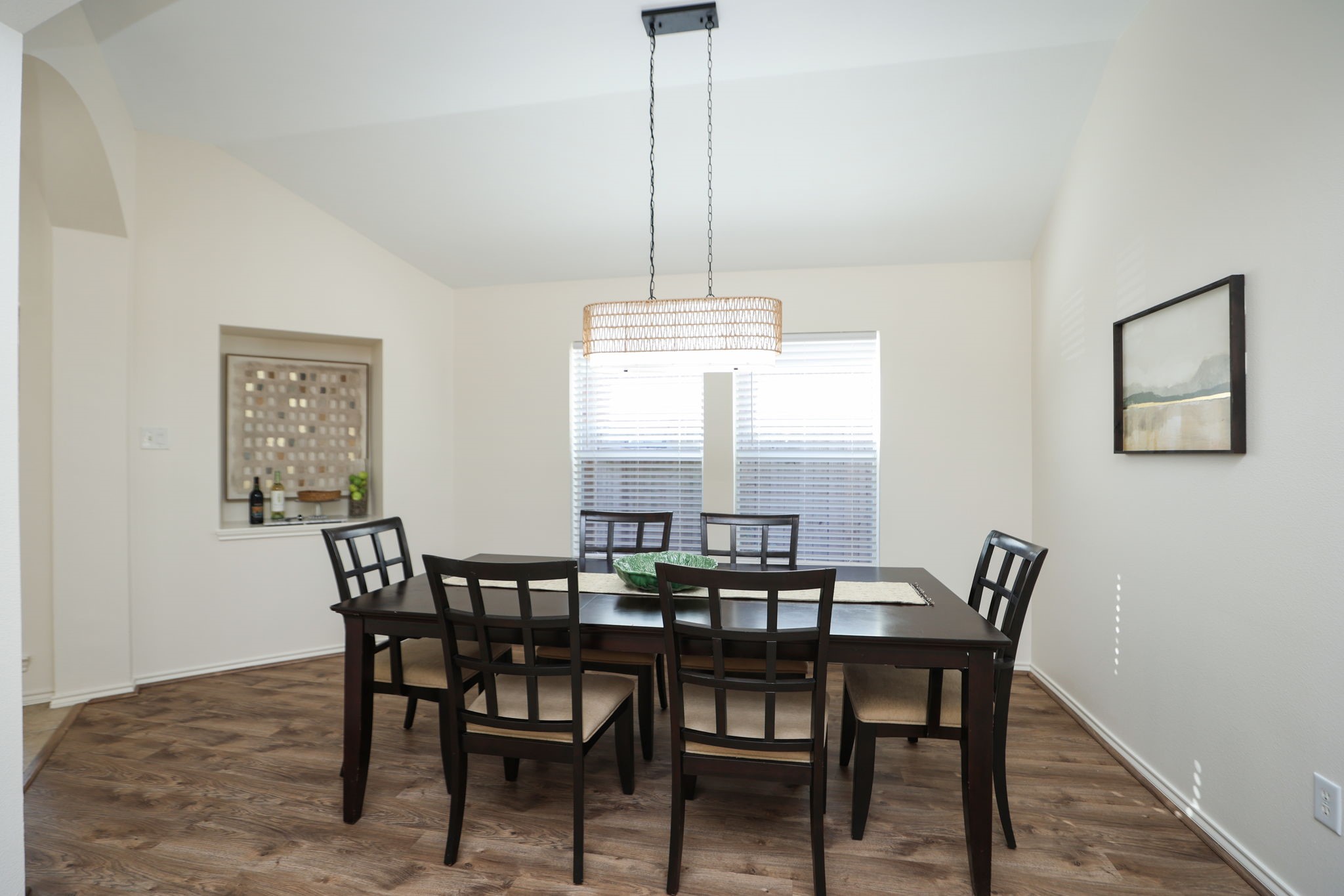 Spacious dining room with modern light fixture and new LVP flooring. Could also be a playroom, 2nd living space, or place for your pool table!
