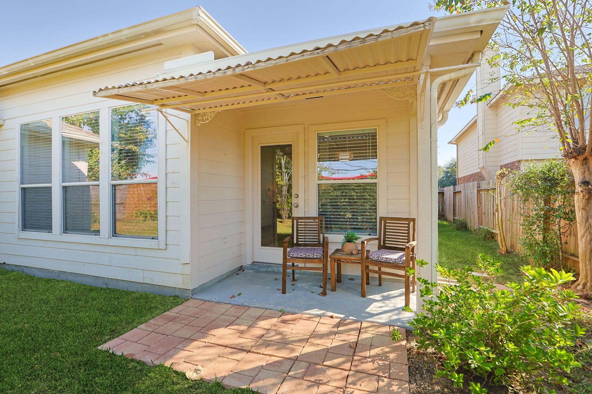 Extended back porch for your morning coffee or watching playtime in the backyard.