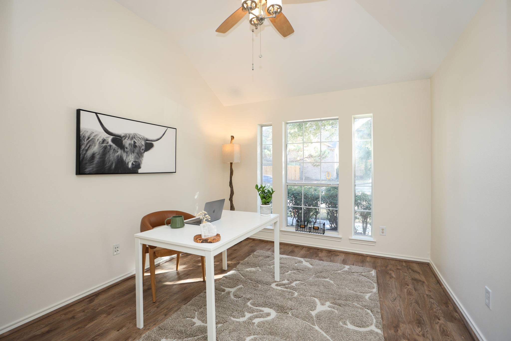 Office is in front of the home overlooking your lush front yard and live oak tree.