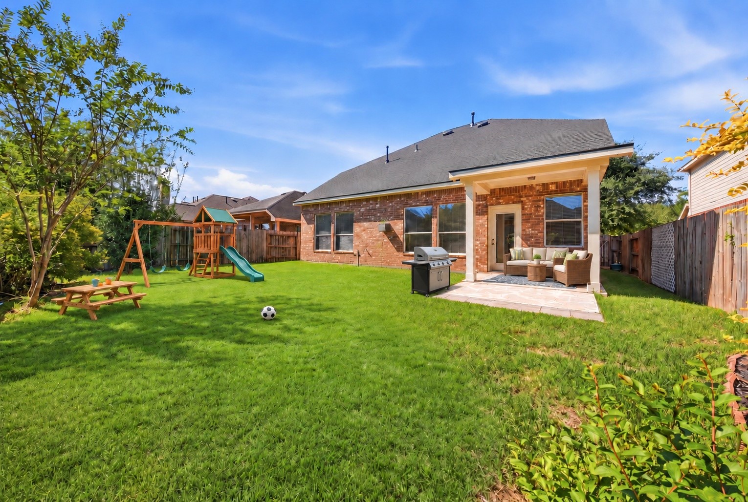 *VIRTUALLY STAGED* Make the backyard your own with space for outdoor games, garden beds, or a playset, plus a covered patio for relaxing in the shade.