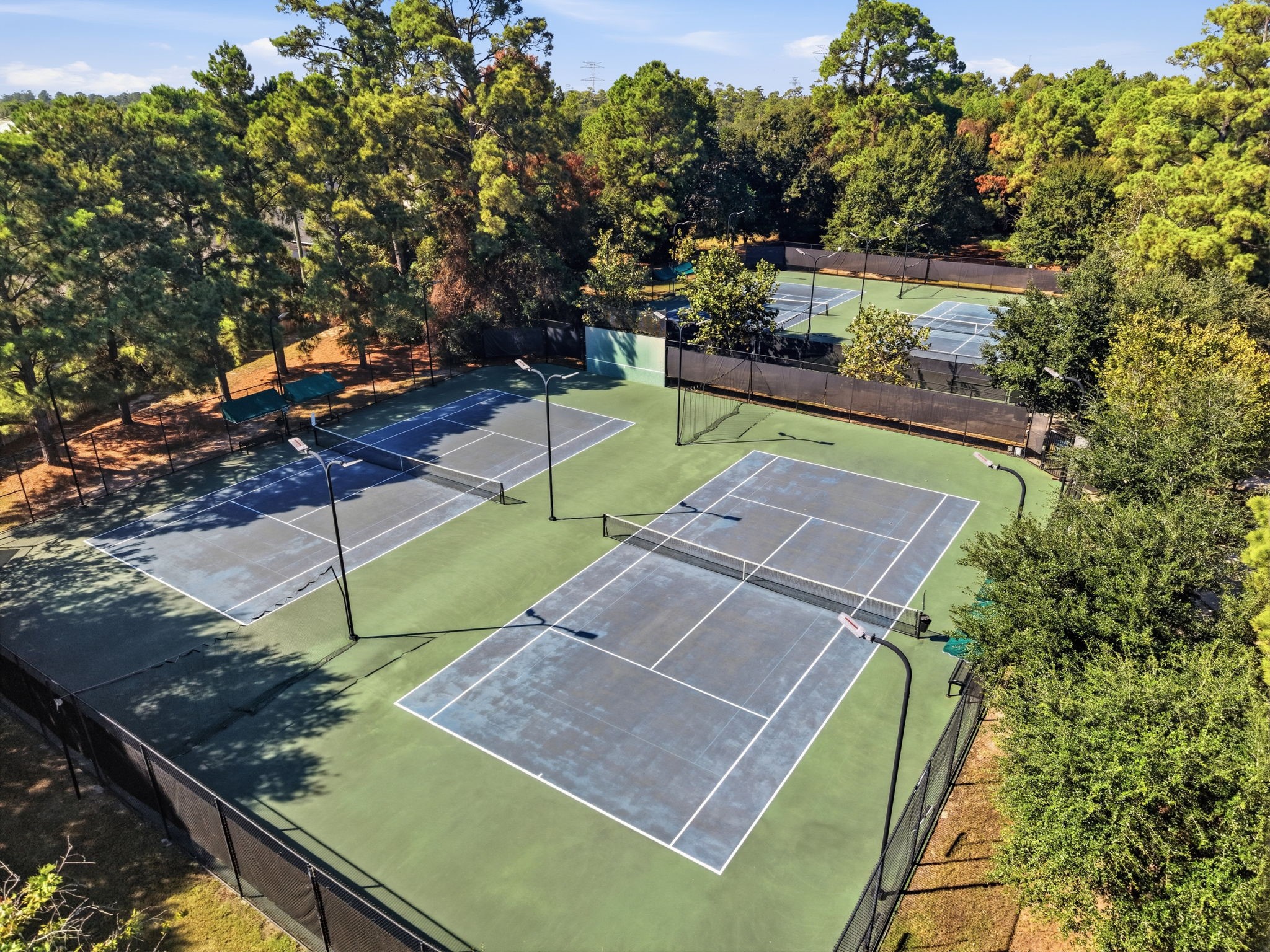Stay active at Fall Creeks lighted tennis courts, surrounded by mature trees with shaded seating for breaks between matches.