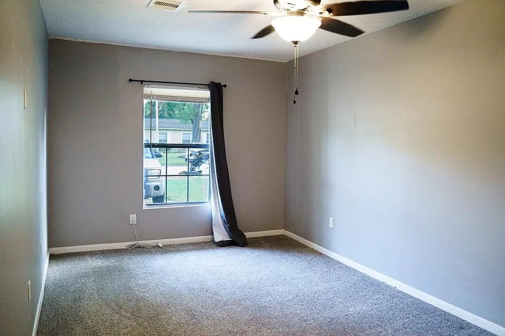 Bedroom with Ceiling Fan and Natural Light